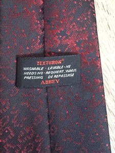 Kingspier Vintage - Abbey dark red and black pattern tie. Texturon (polyester).

Length: 54.5” 
Width: 3.75” 

This tie is in excellent condition.