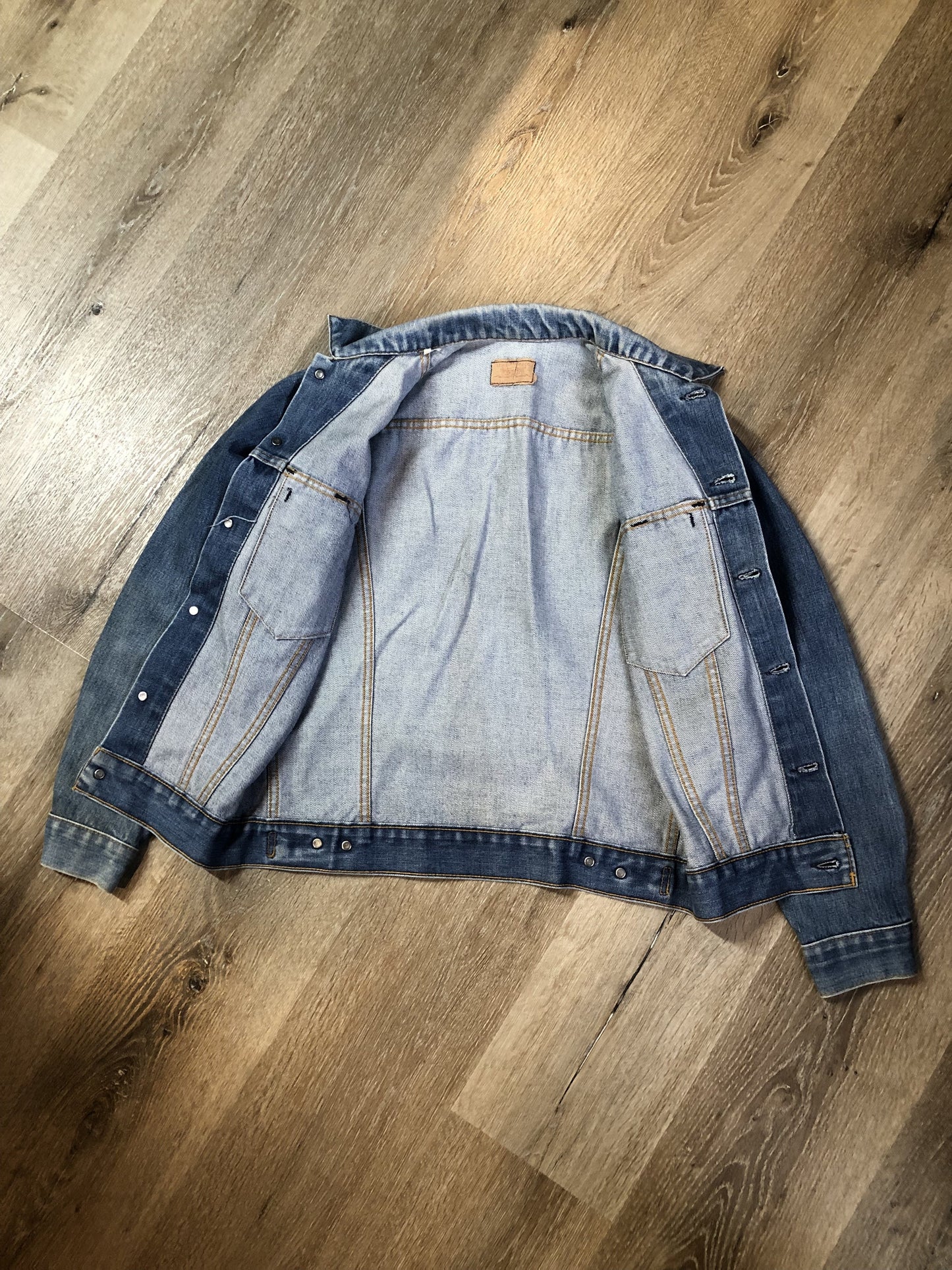 Vintage 1970’s Levi’s medium wash denim trucker jacket with button closures and two flap pockets on the chest. Red Tab, 100% cotton, made in USA, size 18 - Kingspier Vintage