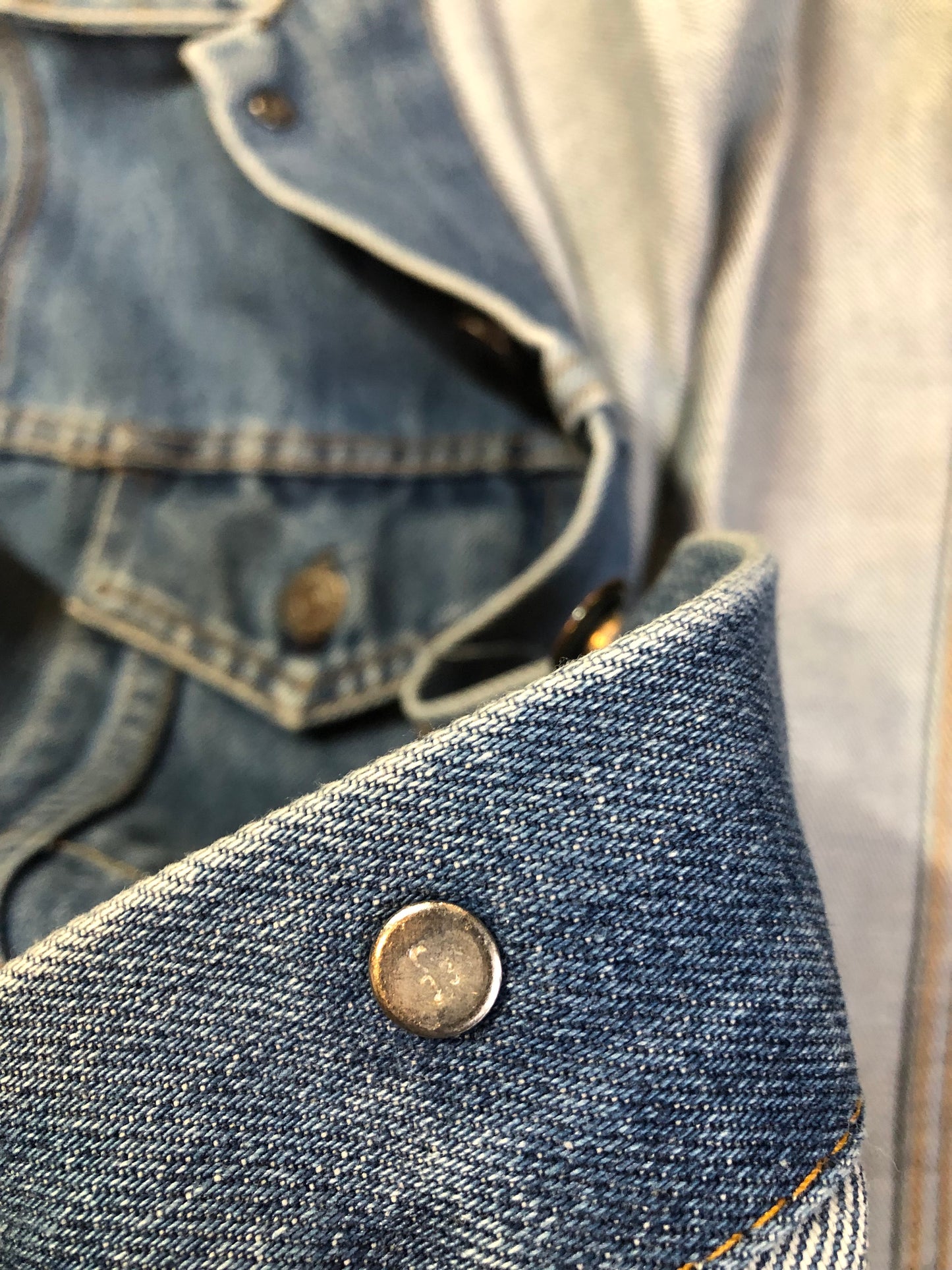 Vintage 1970’s Levi’s medium wash denim trucker jacket with button closures and two flap pockets on the chest. Red Tab, 100% cotton, made in USA, size 18 - Kingspier Vintage