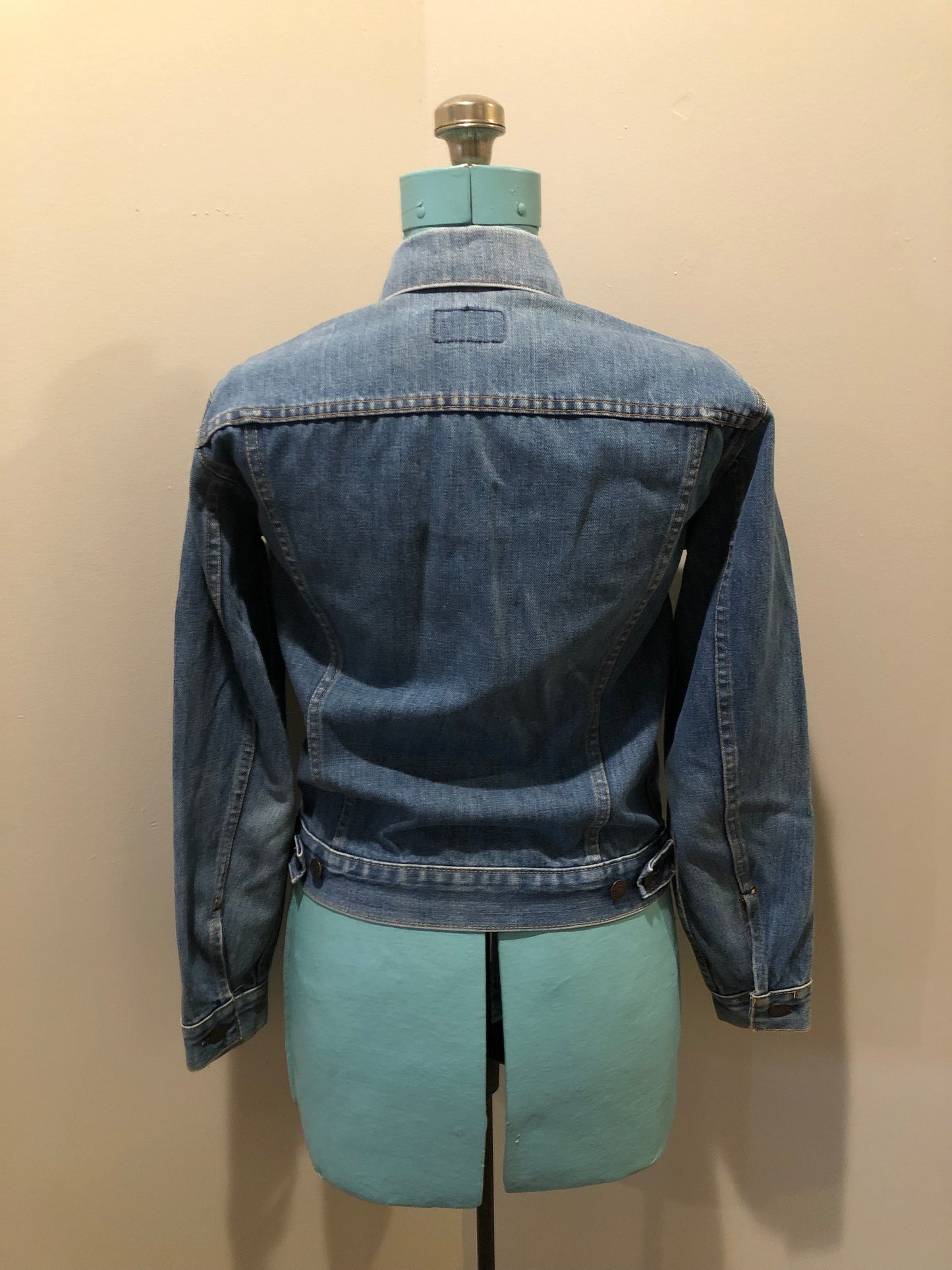 Vintage 1970’s Levi’s medium wash denim trucker jacket with button closures and two flap pockets on the chest. Red Tab, 100% cotton, made in USA, size 18 - Kingspier Vintage