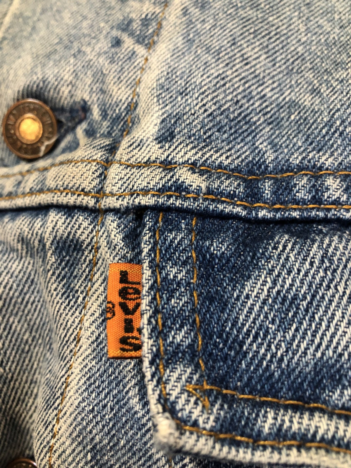 Vintage 1970’s Levi’s light wash denim trucker jacket with button closures and two flap pockets on the chest. Orange Tab, 100% cotton, made in Canada, size 46 - Kingspier Vintage