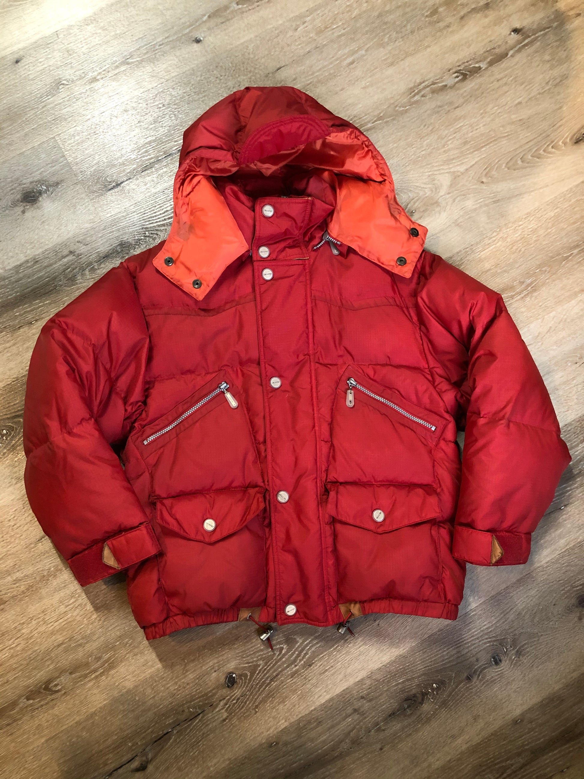 Kingspier Vintage - Vintage Jackpot by Carli Gry red down-fIlled puffer jacket with hood, zipper closure, flap pockets, zip pockets and three inside pockets large enough to fit an included small lightweight backpack,