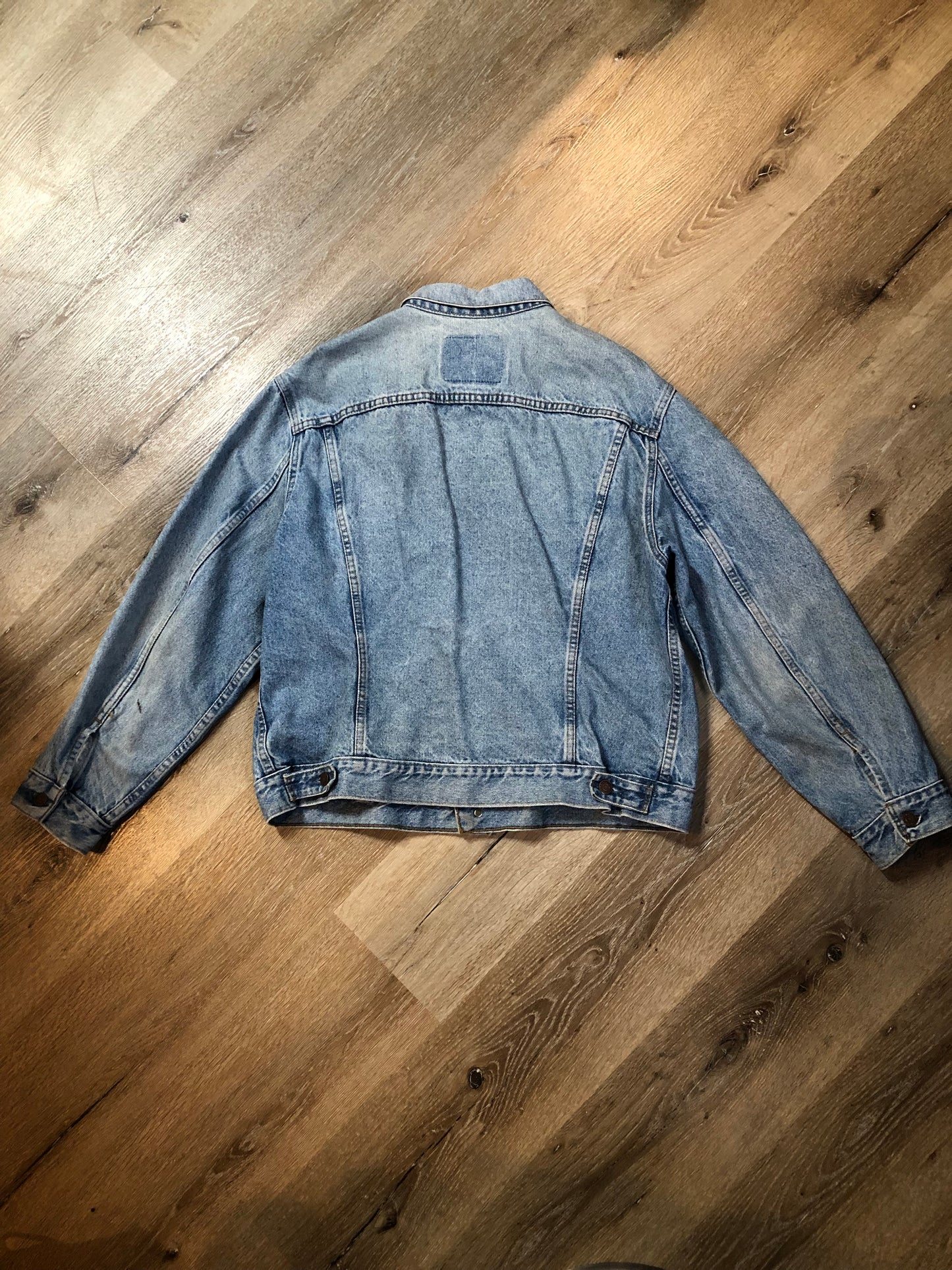 Vintage 1970’s Levi’s light wash denim trucker jacket with button closures and two flap pockets on the chest. Orange Tab, 100% cotton, made in Canada, size 46 - Kingspier Vintage