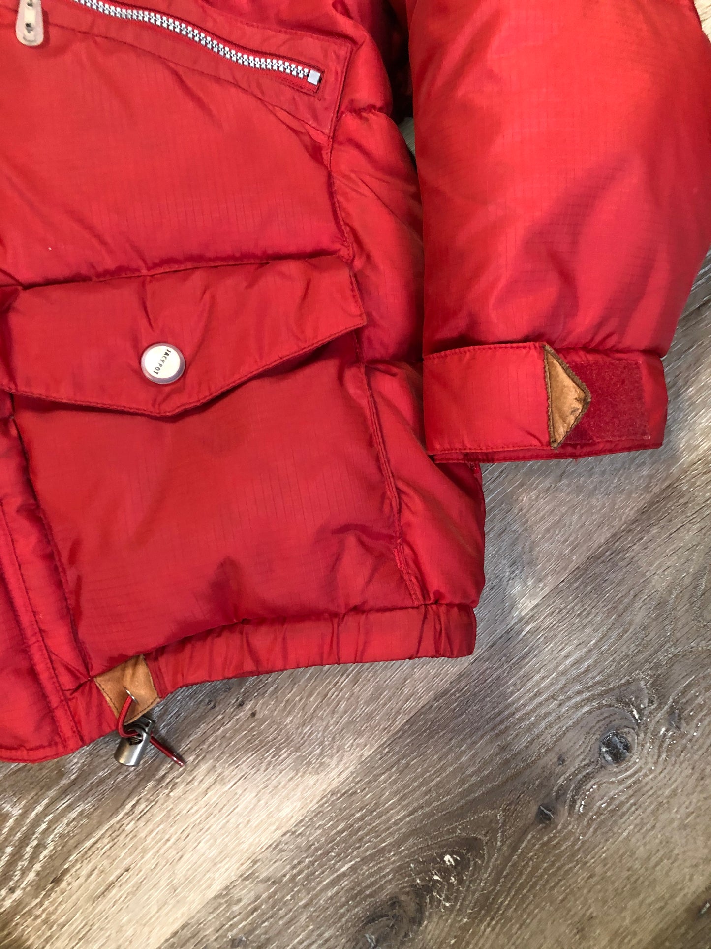 Kingspier Vintage - Vintage Jackpot by Carli Gry red down-fIlled puffer jacket with hood, zipper closure, flap pockets, zip pockets and three inside pockets large enough to fit an included small lightweight backpack,