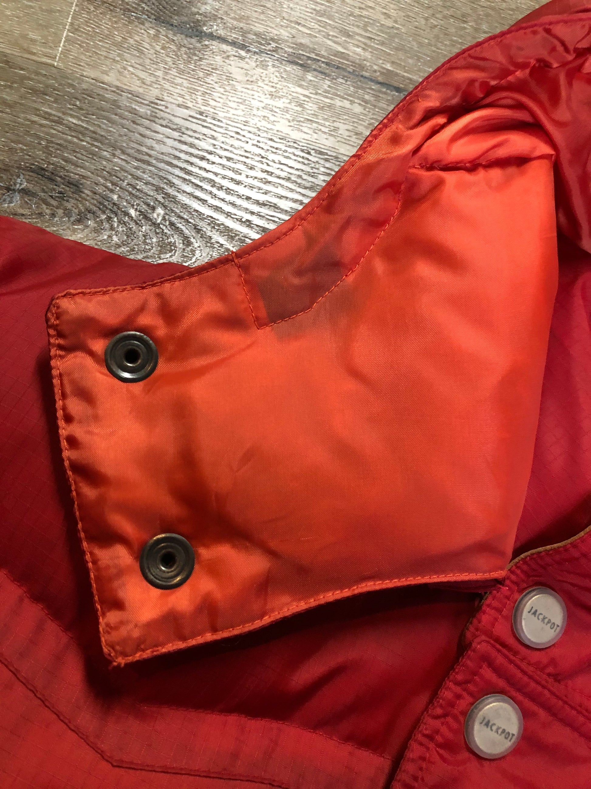 Kingspier Vintage - Vintage Jackpot by Carli Gry red down-fIlled puffer jacket with hood, zipper closure, flap pockets, zip pockets and three inside pockets large enough to fit an included small lightweight backpack,