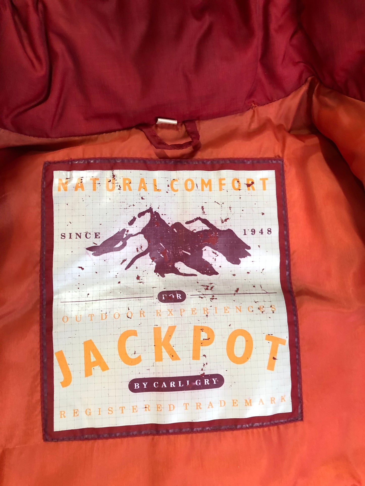 Kingspier Vintage - Vintage Jackpot by Carli Gry red down-fIlled puffer jacket with hood, zipper closure, flap pockets, zip pockets and three inside pockets large enough to fit an included small lightweight backpack,
