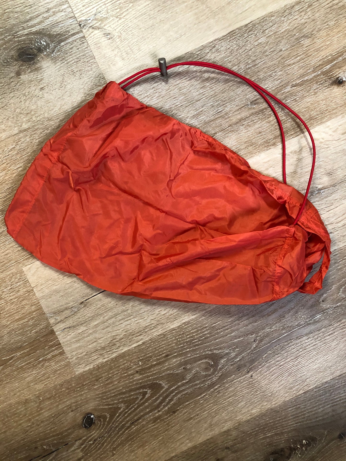 Kingspier Vintage - Vintage Jackpot by Carli Gry red down-fIlled puffer jacket with hood, zipper closure, flap pockets, zip pockets and three inside pockets large enough to fit an included small lightweight backpack,