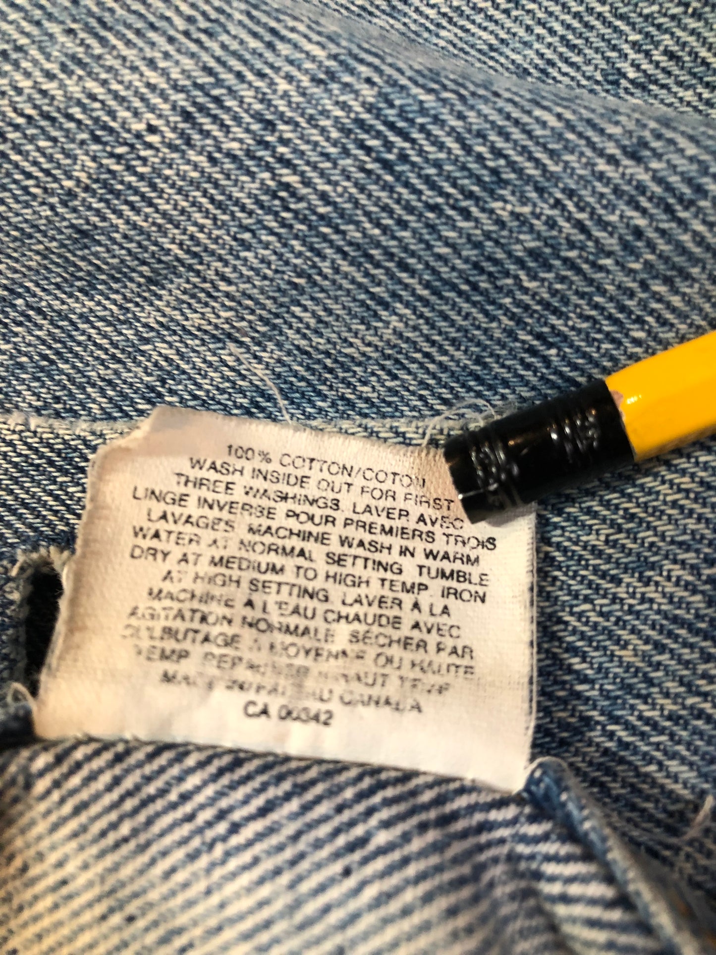 Vintage 1970’s Levi’s light wash denim trucker jacket with button closures and two flap pockets on the chest. Orange Tab, 100% cotton, made in Canada, size 46 - Kingspier Vintage