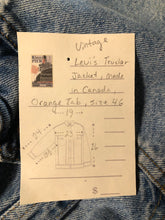 Load image into Gallery viewer, Vintage 1970’s Levi’s light wash denim trucker jacket with button closures and two flap pockets on the chest.  Orange Tab, 100% cotton, made in Canada, size 46 - Kingspier Vintage
