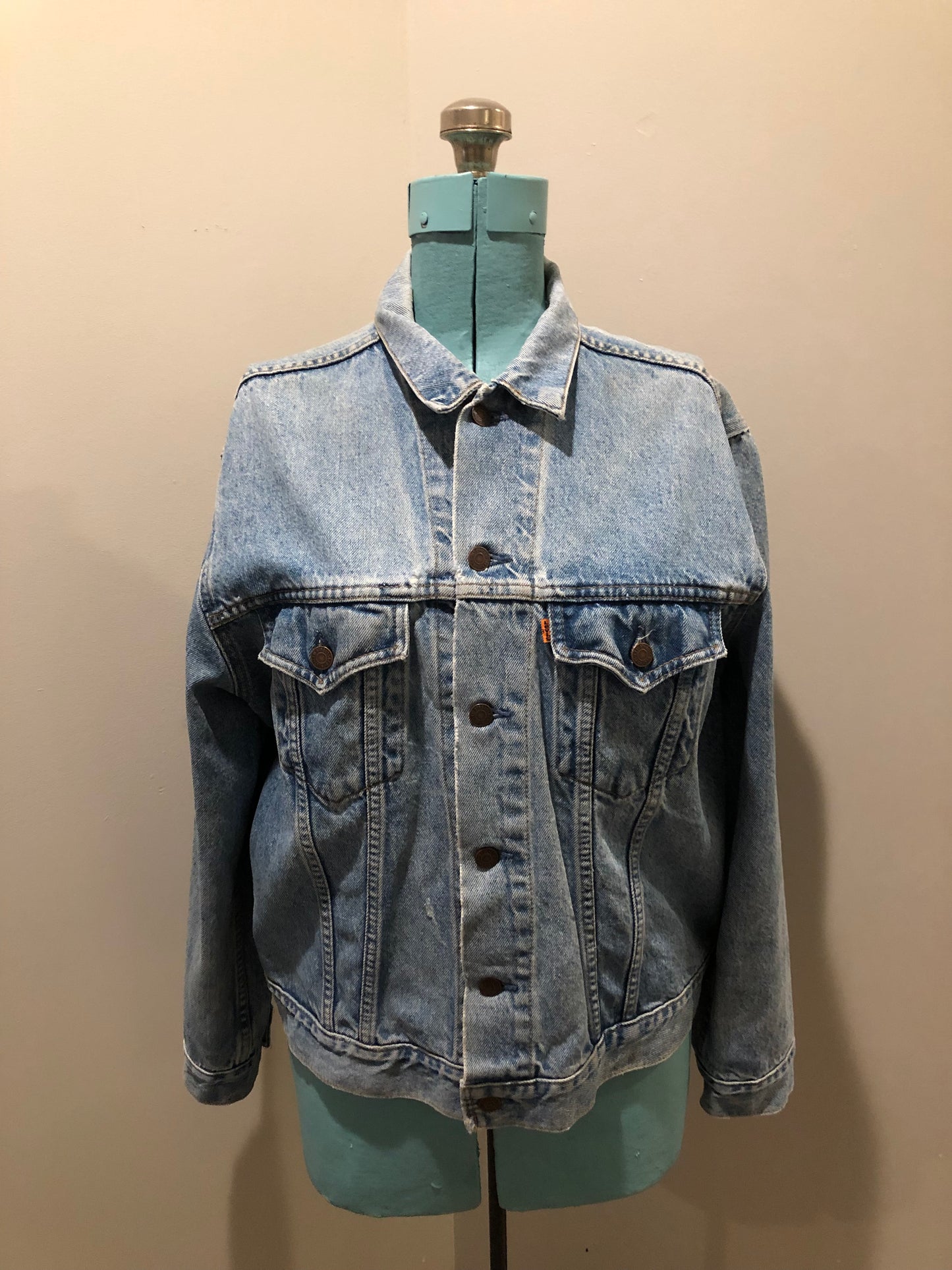 Vintage 1970’s Levi’s light wash denim trucker jacket with button closures and two flap pockets on the chest. Orange Tab, 100% cotton, made in Canada, size 46 - Kingspier Vintage