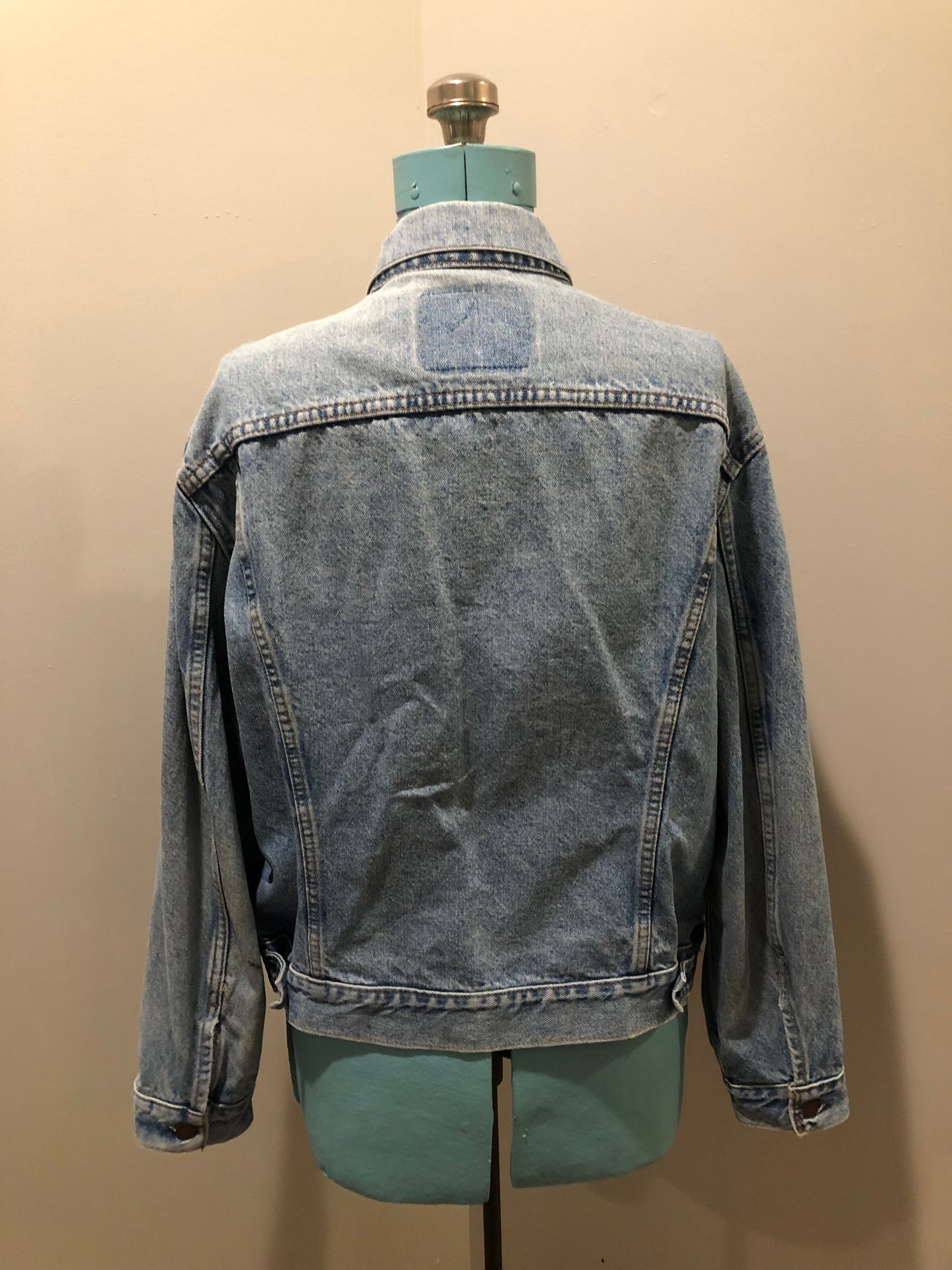 Vintage 1970’s Levi’s light wash denim trucker jacket with button closures and two flap pockets on the chest. Orange Tab, 100% cotton, made in Canada, size 46 - Kingspier Vintage