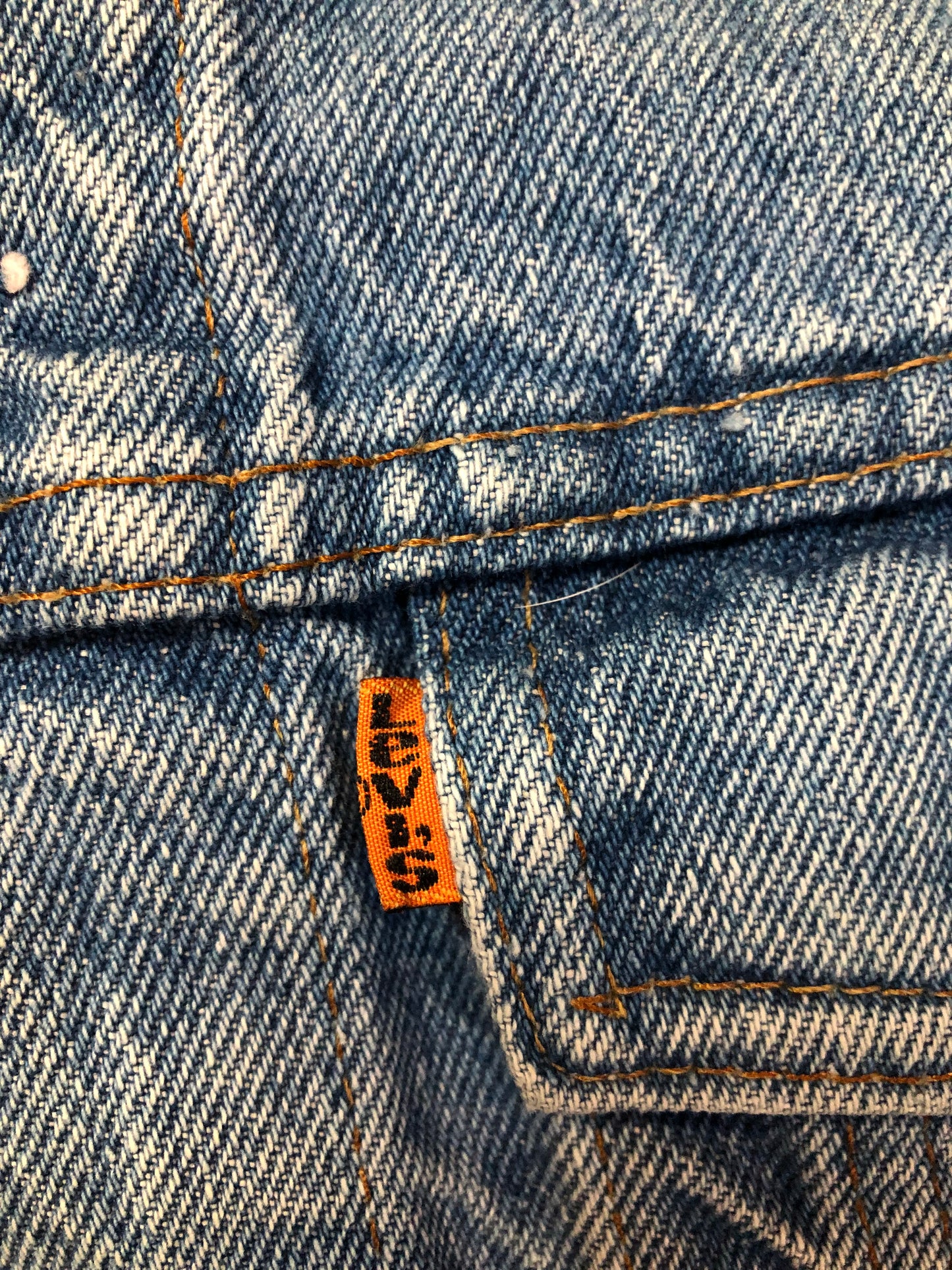 Vintage 1970’s Levi’s light wash denim trucker jacket with button closures and two flap pockets on the chest. Orange Tab, 100% cotton, made in Canada, size 40 - Kingspier Vintage