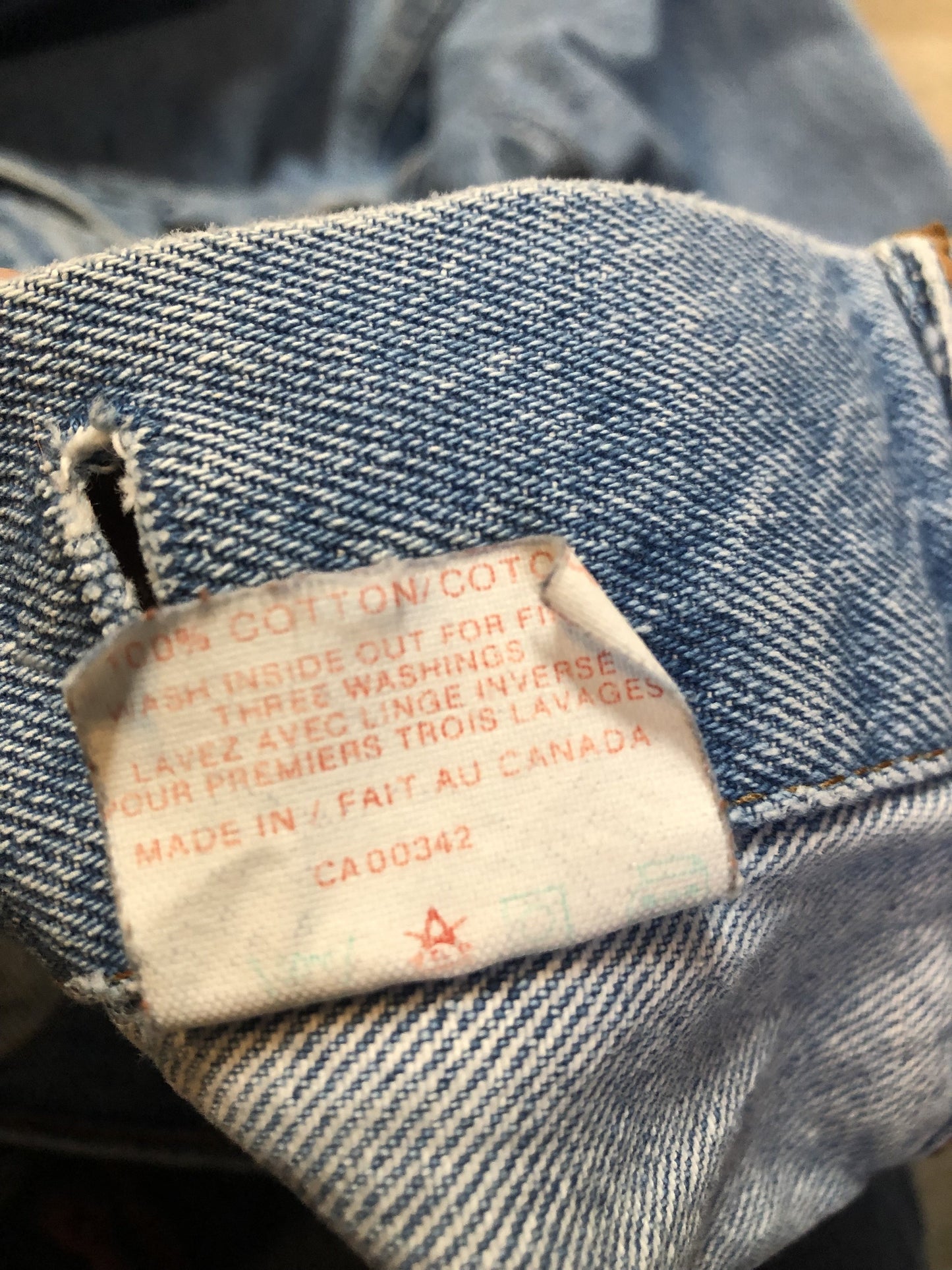 Vintage 1970’s Levi’s light wash denim trucker jacket with button closures and two flap pockets on the chest. Orange Tab, 100% cotton, made in Canada, size 40 - Kingspier Vintage