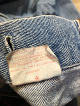 Load image into Gallery viewer, Vintage 1970’s Levi’s light wash denim trucker jacket with button closures and two flap pockets on the chest.  Orange Tab, 100% cotton, made in Canada, size 40  - Kingspier Vintage

