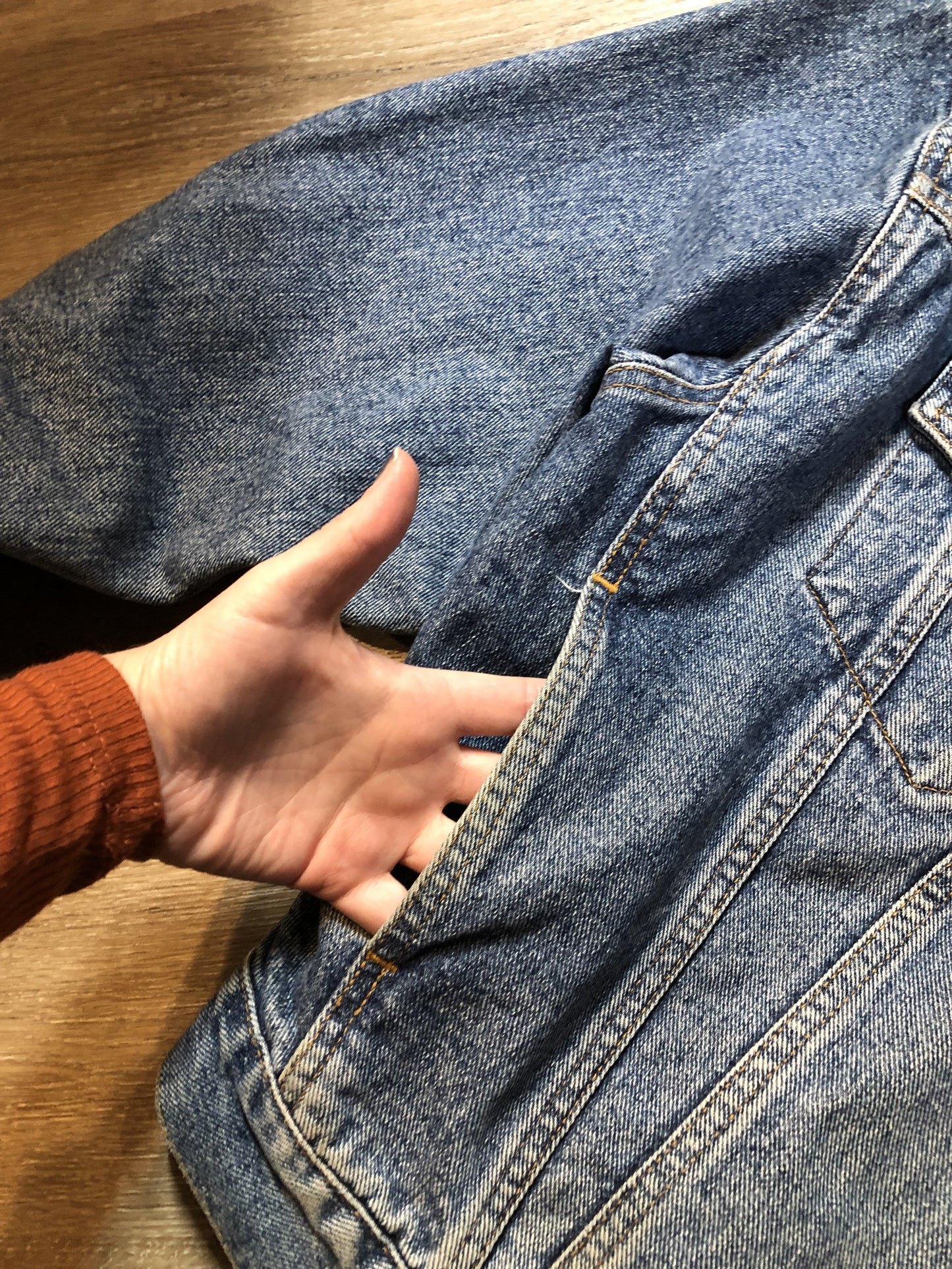 Vintage 1980’s Levi’s medium wash denim trucker jacket with button closures, two flap pockets on the chest, two side pockets and two inside pockets. Red Tab, 100% cotton, size large -Kingspier Vintage