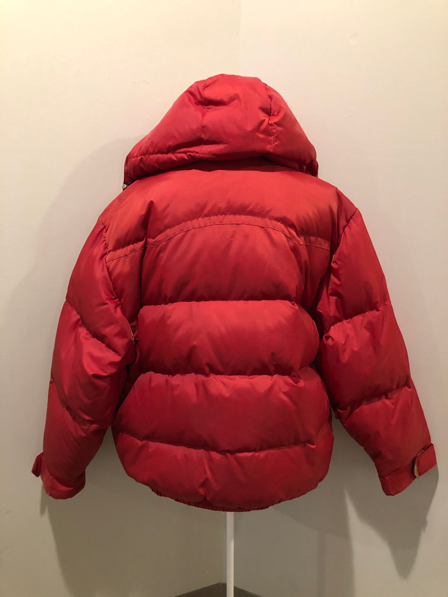 Kingspier Vintage - Vintage Jackpot by Carli Gry red down-fIlled puffer jacket with hood, zipper closure, flap pockets, zip pockets and three inside pockets large enough to fit an included small lightweight backpack,