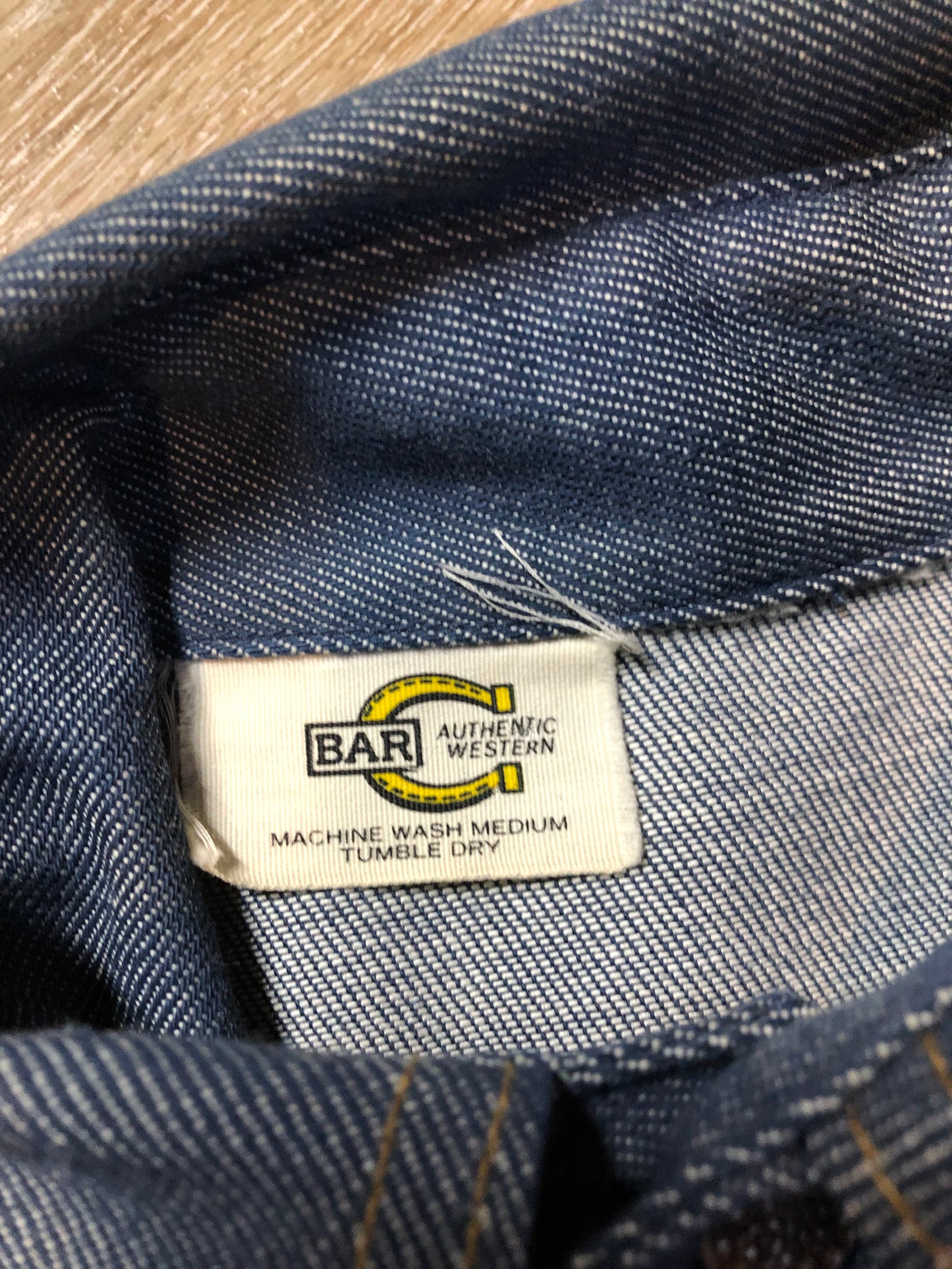 Vintage Bar C Authentic Western medium wash denim shirt jacket with button closures, two flap pockets on the chest and a custom rose design embroidered on the back. Made in USA, size med/ large - Kingspier Vintage