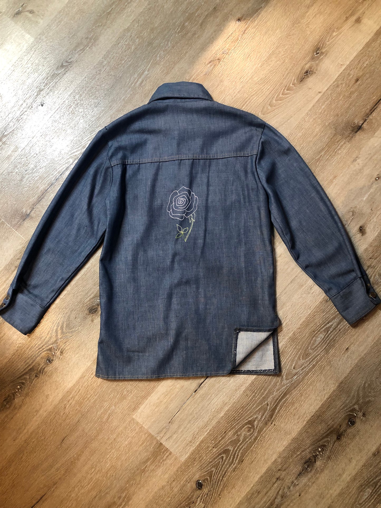 Vintage Bar C Authentic Western medium wash denim shirt jacket with button closures, two flap pockets on the chest and a custom rose design embroidered on the back. Made in USA, size med/ large - Kingspier Vintage