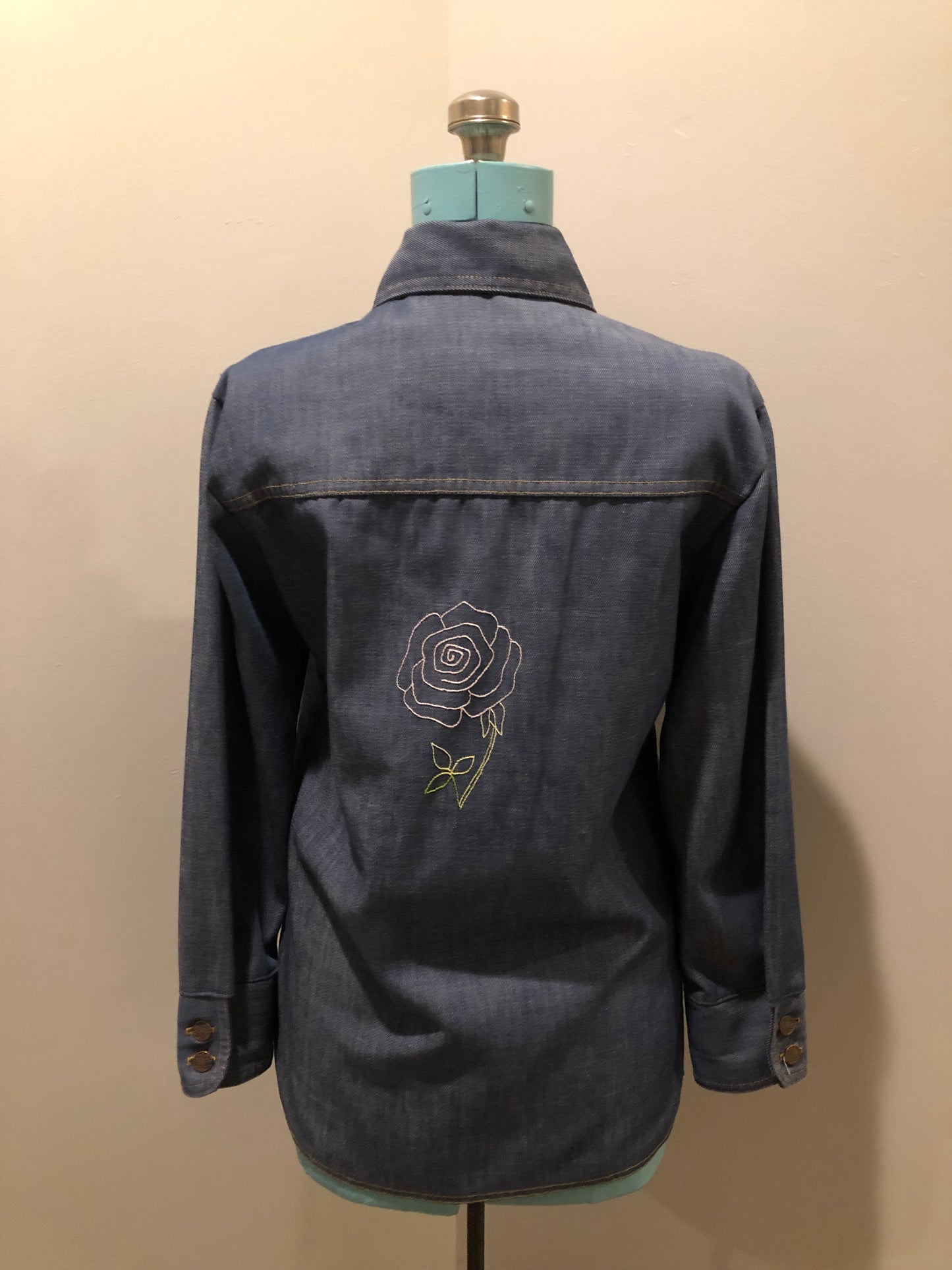 Vintage Bar C Authentic Western medium wash denim shirt jacket with button closures, two flap pockets on the chest and a custom rose design embroidered on the back. Made in USA, size med/ large - Kingspier Vintage