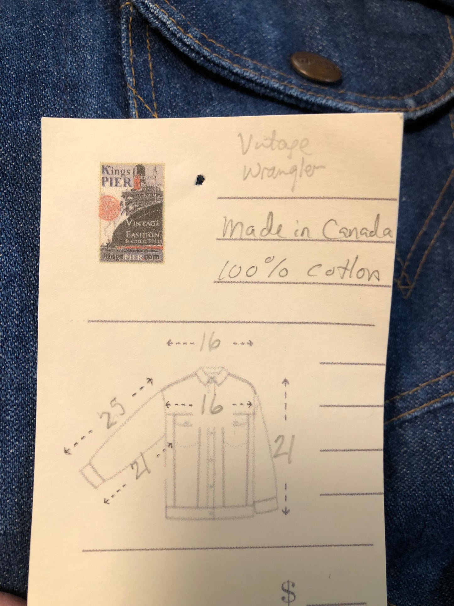 Vintage Wrangler medium wash denim jacket with button closures, two flap pockets on the chest and two hand warmer pockets in the front. 100% cotton, made in Canada, size 32 - Kingspier Vintage