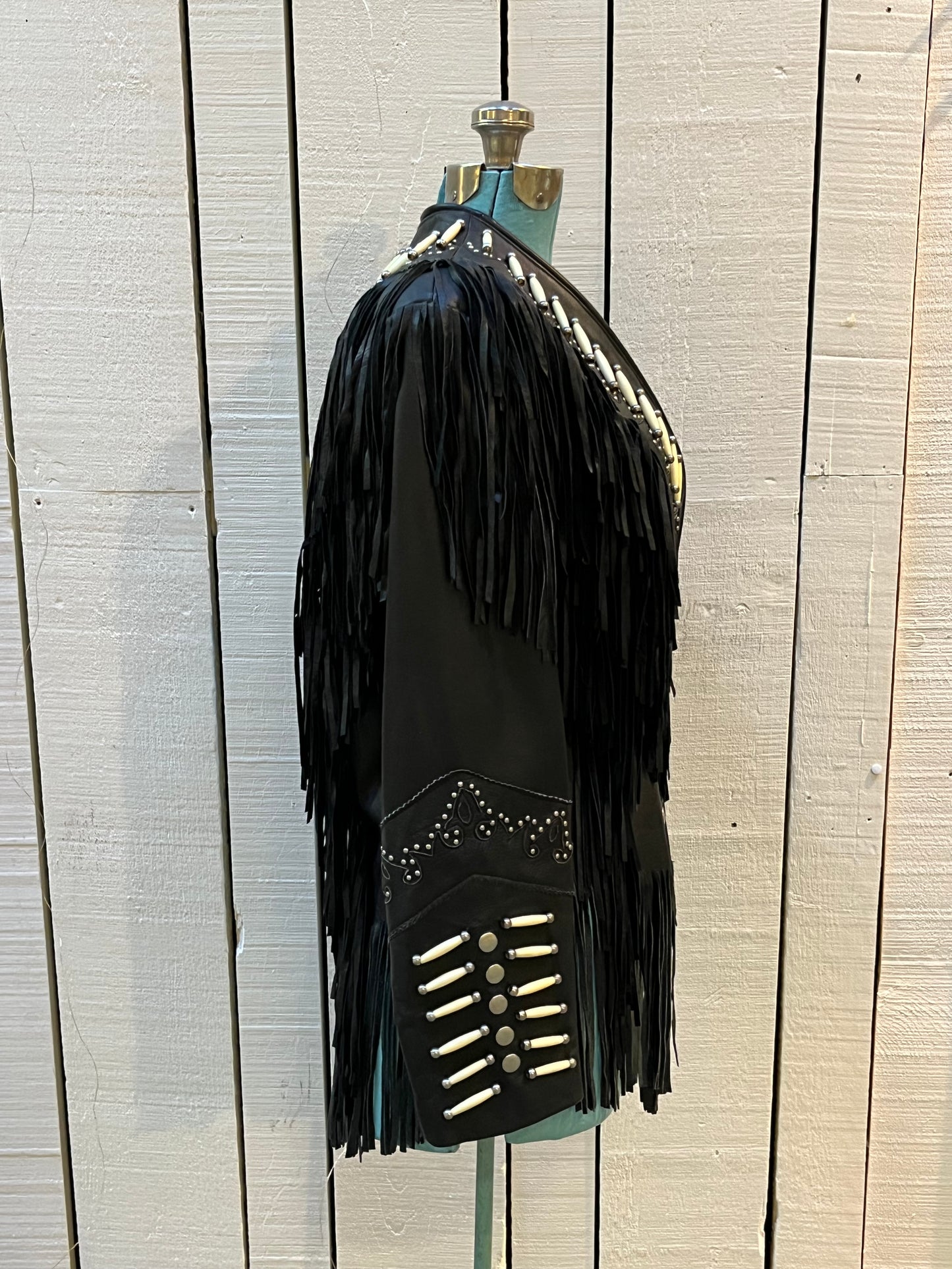 Rare authentic vintage leather jacket with fringe once owned by June Carter. Consigned by a former member of Johnny Cash’s band from 1987-1990.
The Western World by Shaf jacket features snap closures, leather fringe, beaded and stud details.
Size Medium