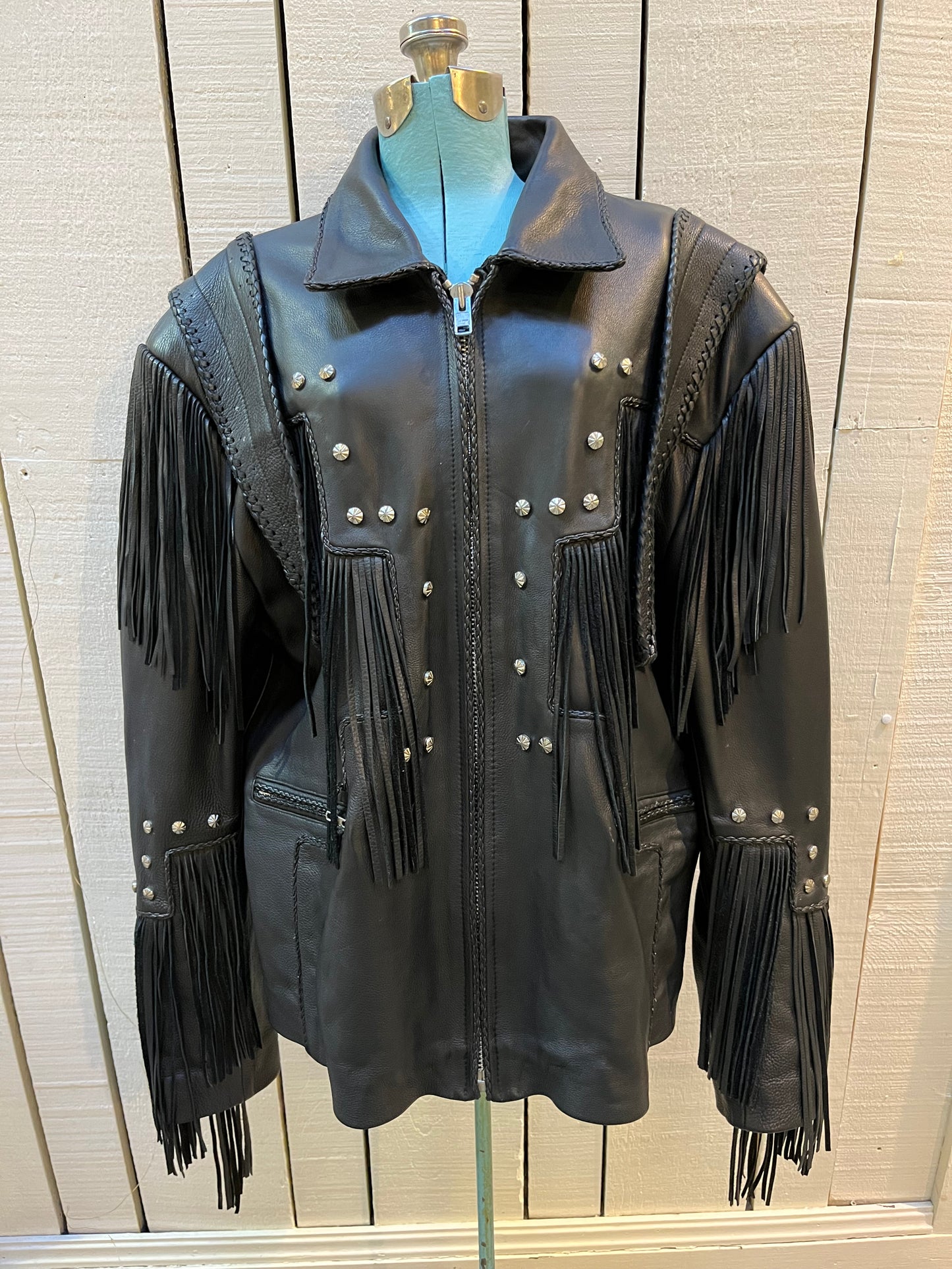 Rare authentic vintage leather jacket with fringe once owned by Johnny Cash. Consigned by a former member of Johnny Cash’s band from 1987-1990.
The piece features zipper closure, zip pockets, leather fringe and stud details
Chest 52”