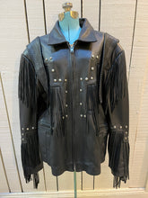 Load image into Gallery viewer, Rare authentic vintage leather jacket with fringe once owned by Johnny Cash. Consigned by a former member of Johnny Cash’s band from 1987-1990. 

The piece features zipper closure, zip pockets, leather fringe and stud details

Chest 52”
