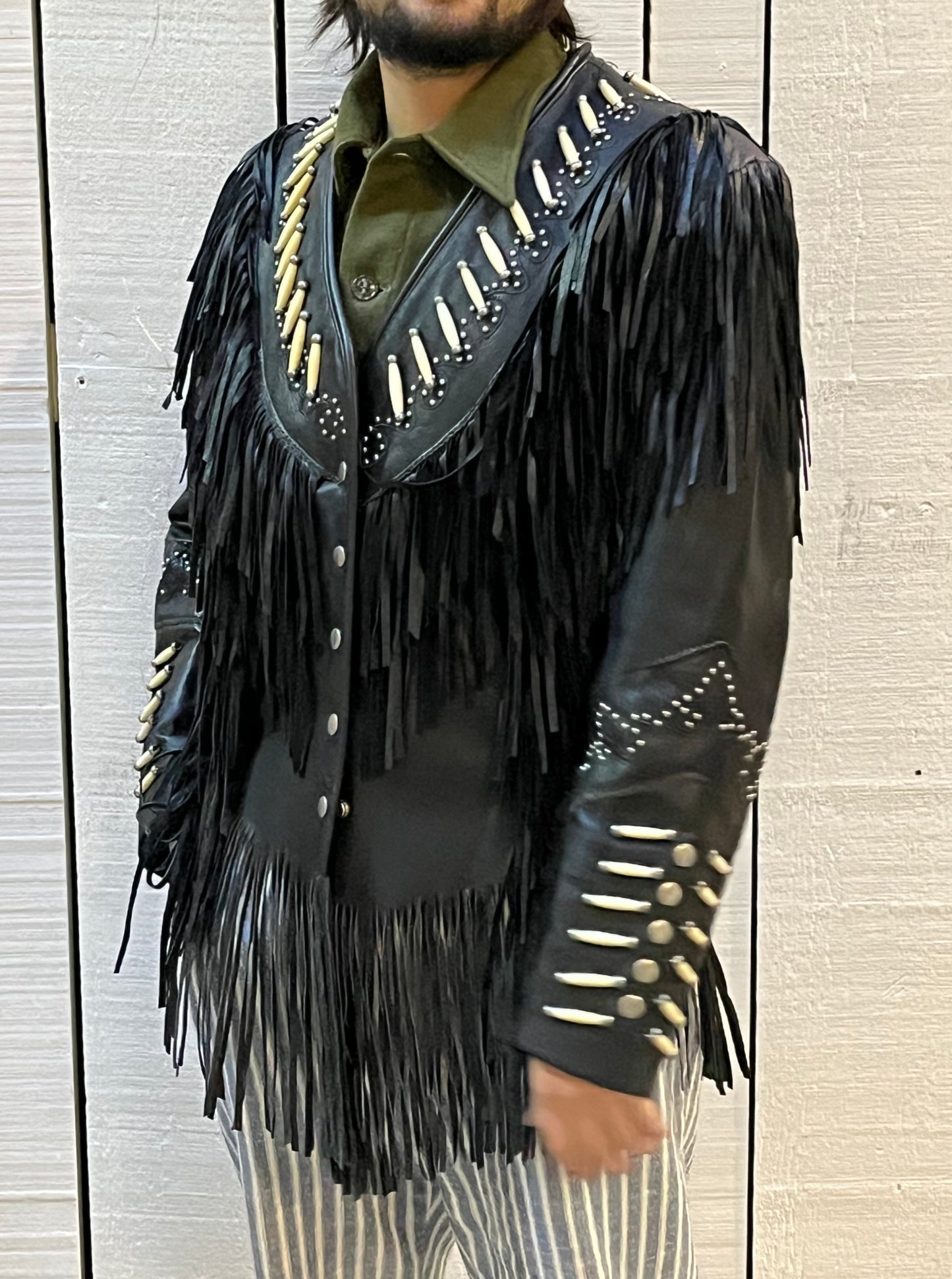 Rare authentic vintage leather jacket with fringe once owned by June Carter. Consigned by a former member of Johnny Cash’s band from 1987-1990.
The Western World by Shaf jacket features snap closures, leather fringe, beaded and stud details.
Size Medium
