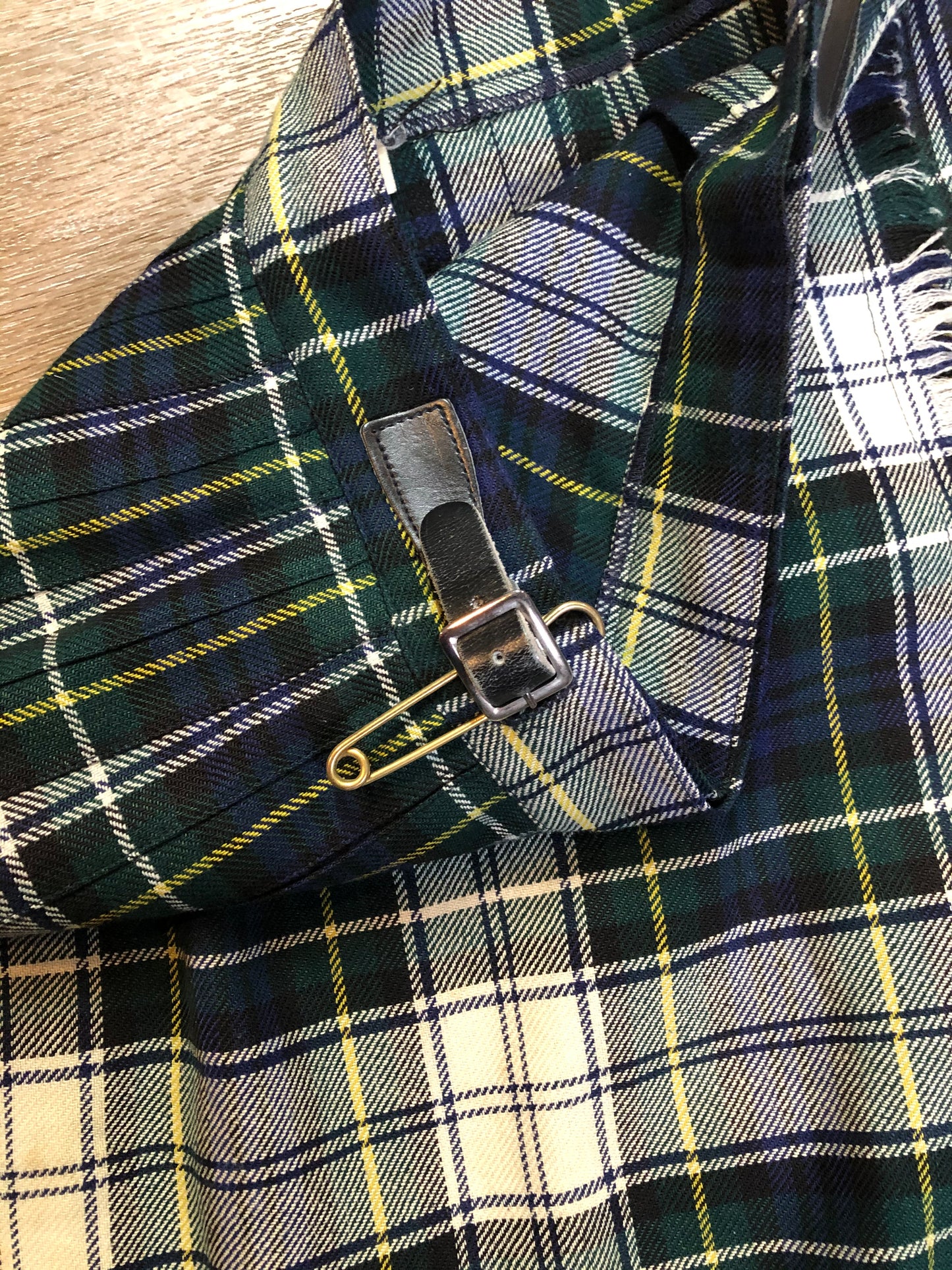 Kingspier Vintage - Vintage RJ McCarthy LTD white, green, blue, yellow and black plaid wool kilt with adjustable leather straps and a fringed over skirt. Made in Canada. Size 16.