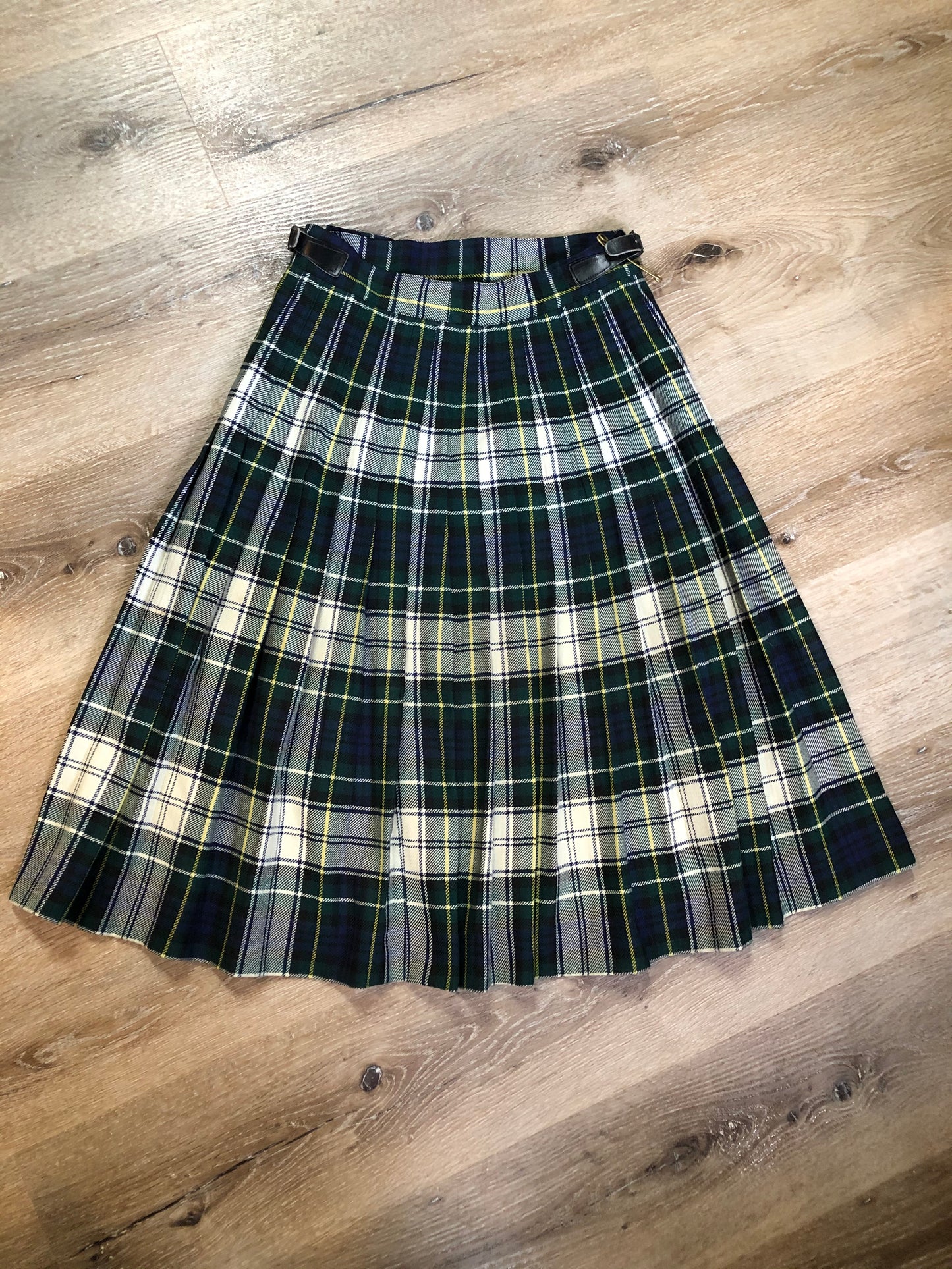 Kingspier Vintage - Vintage RJ McCarthy LTD white, green, blue, yellow and black plaid wool kilt with adjustable leather straps and a fringed over skirt. Made in Canada. Size 16.