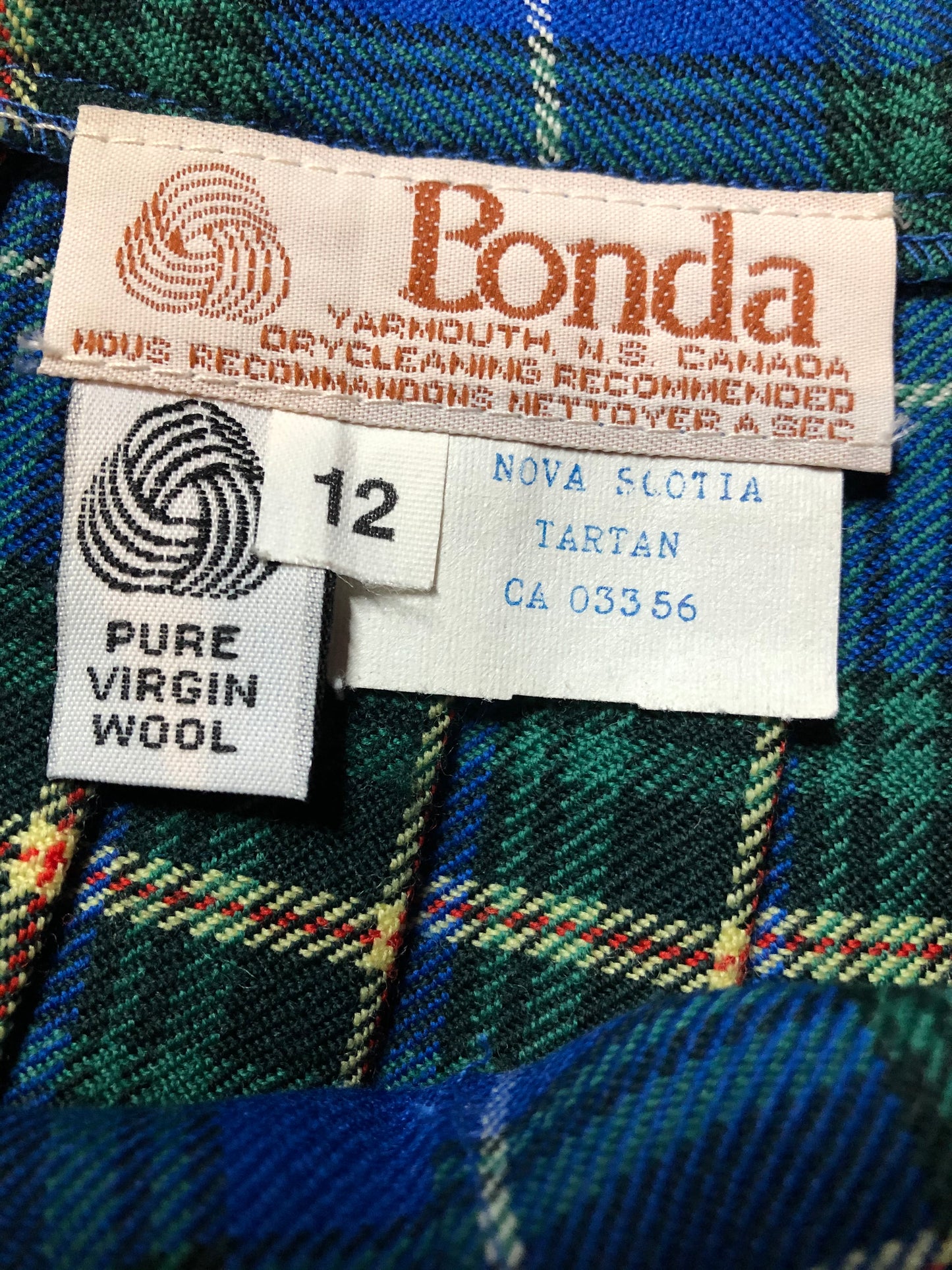 Kingspier Vintage - Bonda Nova Scotia tartan 100% wool kilt with fabric buttons and fringed over skirt. Made in Yarmouth, Nova Scotia, Canada. Size 12.