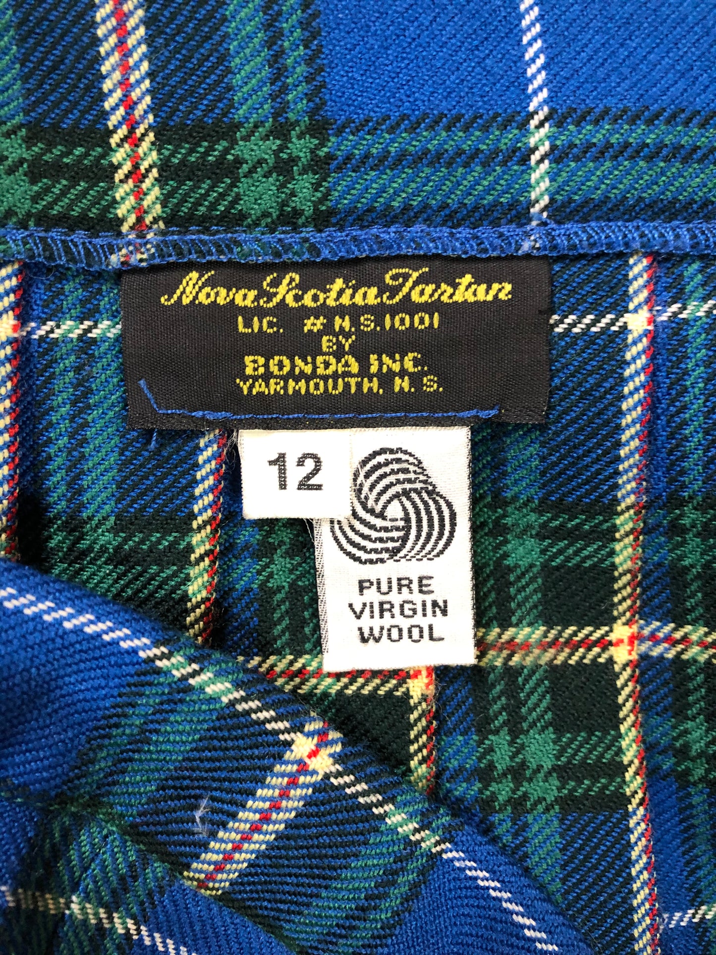 Kingspier Vintage - Bonda Nova Scotia tartan 100% wool kilt with fabric buttons and fringed over skirt. Made in Yarmouth, Nova Scotia, Canada. Size 12.