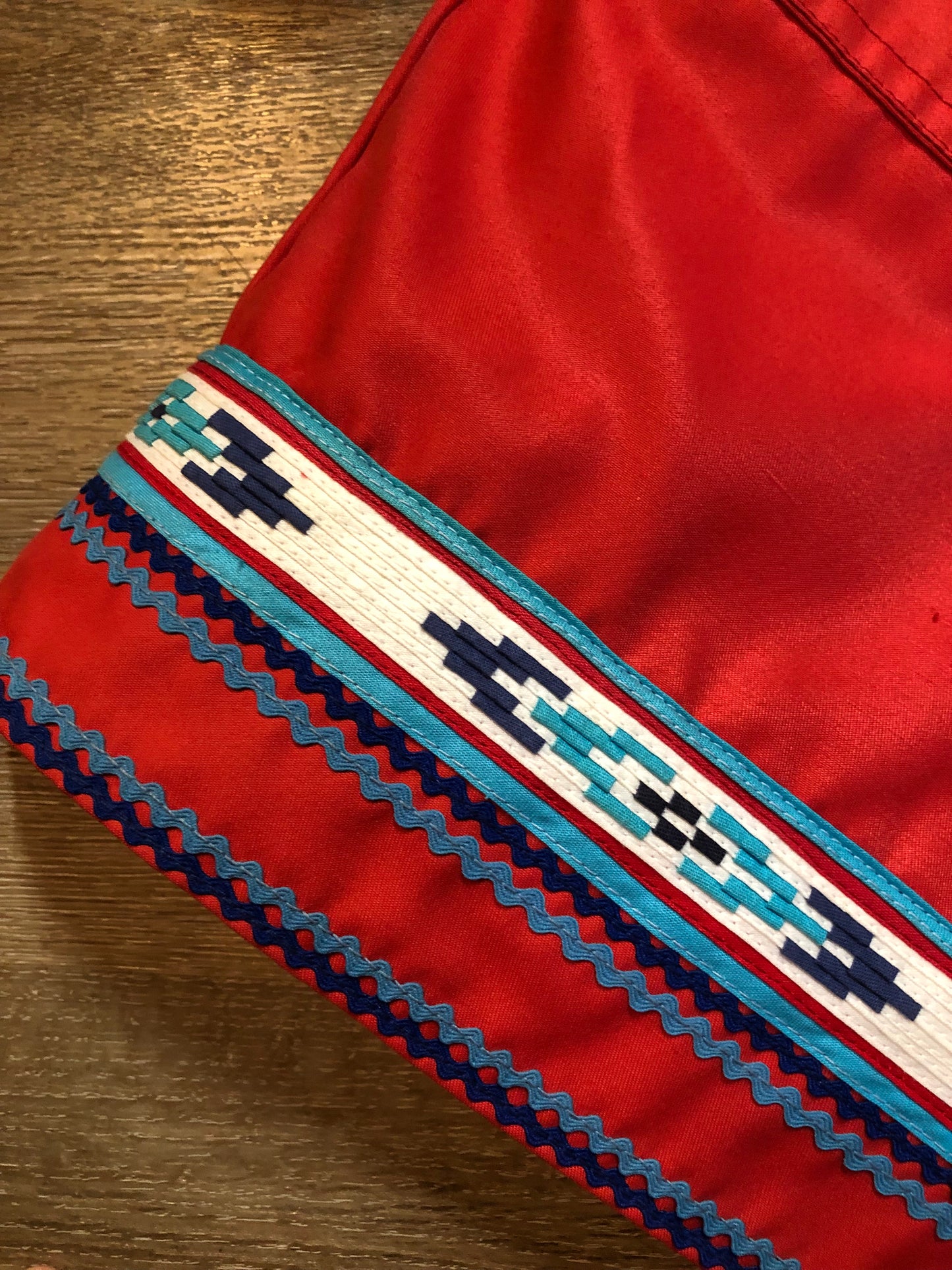 Vintage Inuvik Parka Enterprise red 100% pure wool northern parka. This parka features a cotton/ polyester blend storm shell with embroidered details, a fur trimmed hood, zipper closure, patch pockets, satin lining and a northern fishing design in felt applique. Made in northern Canada. Size 46 - Kingspier Vintage