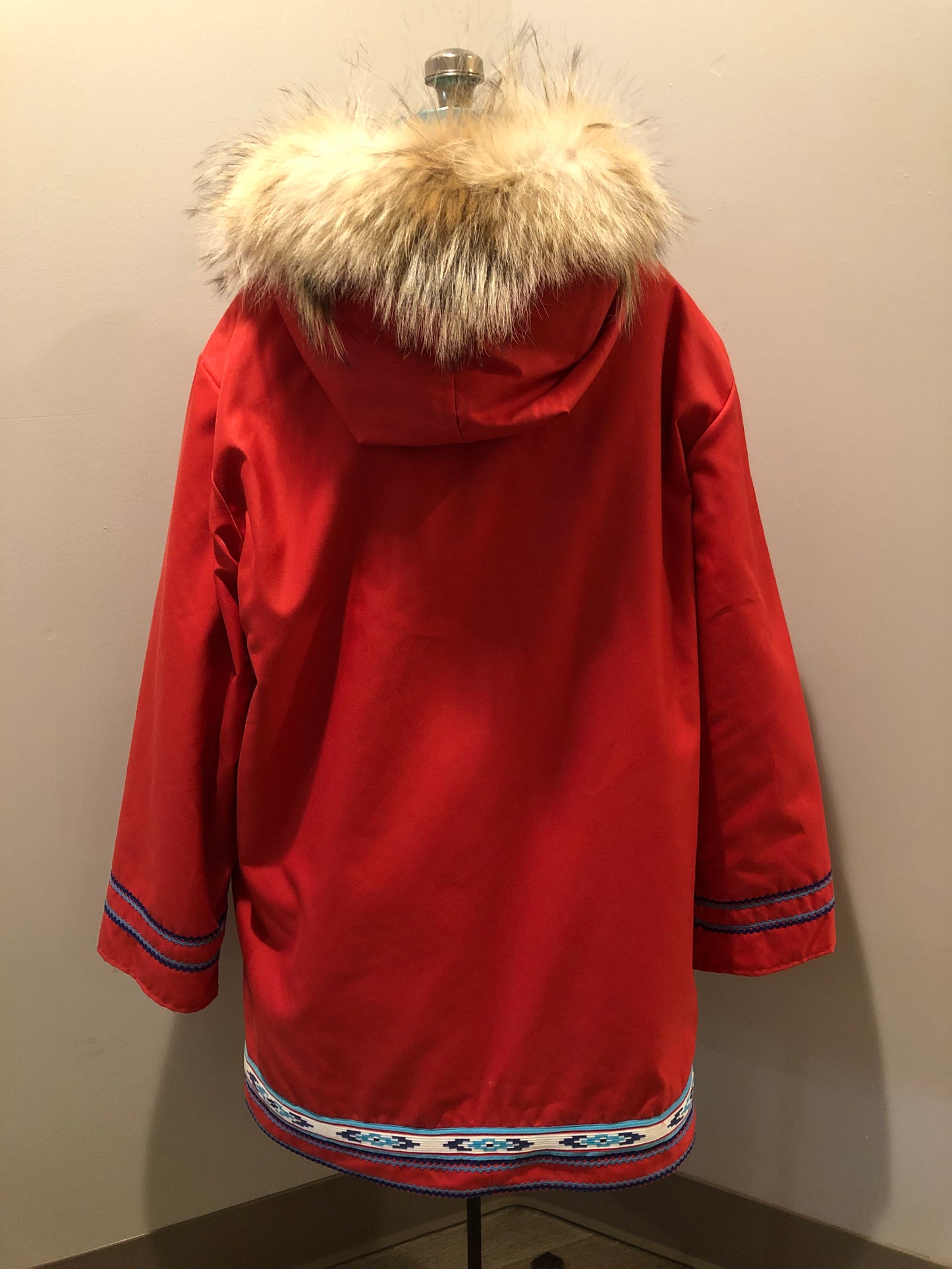 Vintage Inuvik Parka Enterprise red 100% pure wool northern parka. This parka features a cotton/ polyester blend storm shell with embroidered details, a fur trimmed hood, zipper closure, patch pockets, satin lining and a northern fishing design in felt applique. Made in northern Canada. Size 46 - Kingspier Vintage
