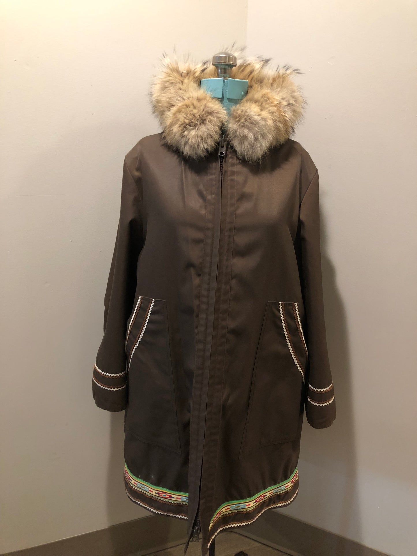 Vintage Inuvik Sewing Company brown 100% pure wool parka. This parka features a cotton/ polyester blend storm shell with embroidered details, a fur trimmed hood, zipper closure, patch pockets, satin lining and a snowshoeing design in felt applique. Made in northern Canada - Kingspier Vintage