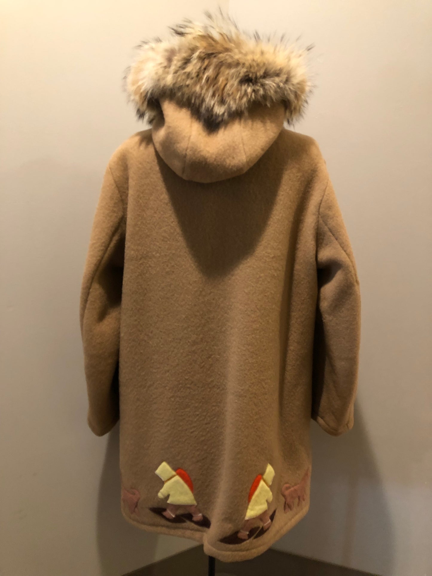 Vintage Inuvik Sewing Company brown 100% pure wool parka. This parka features a cotton/ polyester blend storm shell with embroidered details, a fur trimmed hood, zipper closure, patch pockets, satin lining and a snowshoeing design in felt applique. Made in northern Canada - Kingspier Vintage