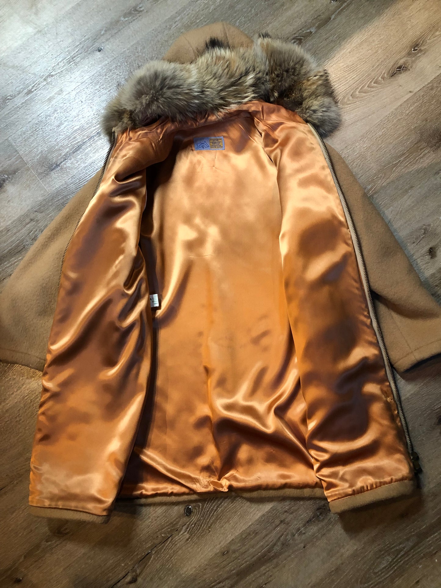 Vintage Inuvik Sewing Company brown 100% pure wool parka. This parka features a cotton/ polyester blend storm shell with embroidered details, a fur trimmed hood, zipper closure, patch pockets, satin lining and a snowshoeing design in felt applique. Made in northern Canada - Kingspier Vintage