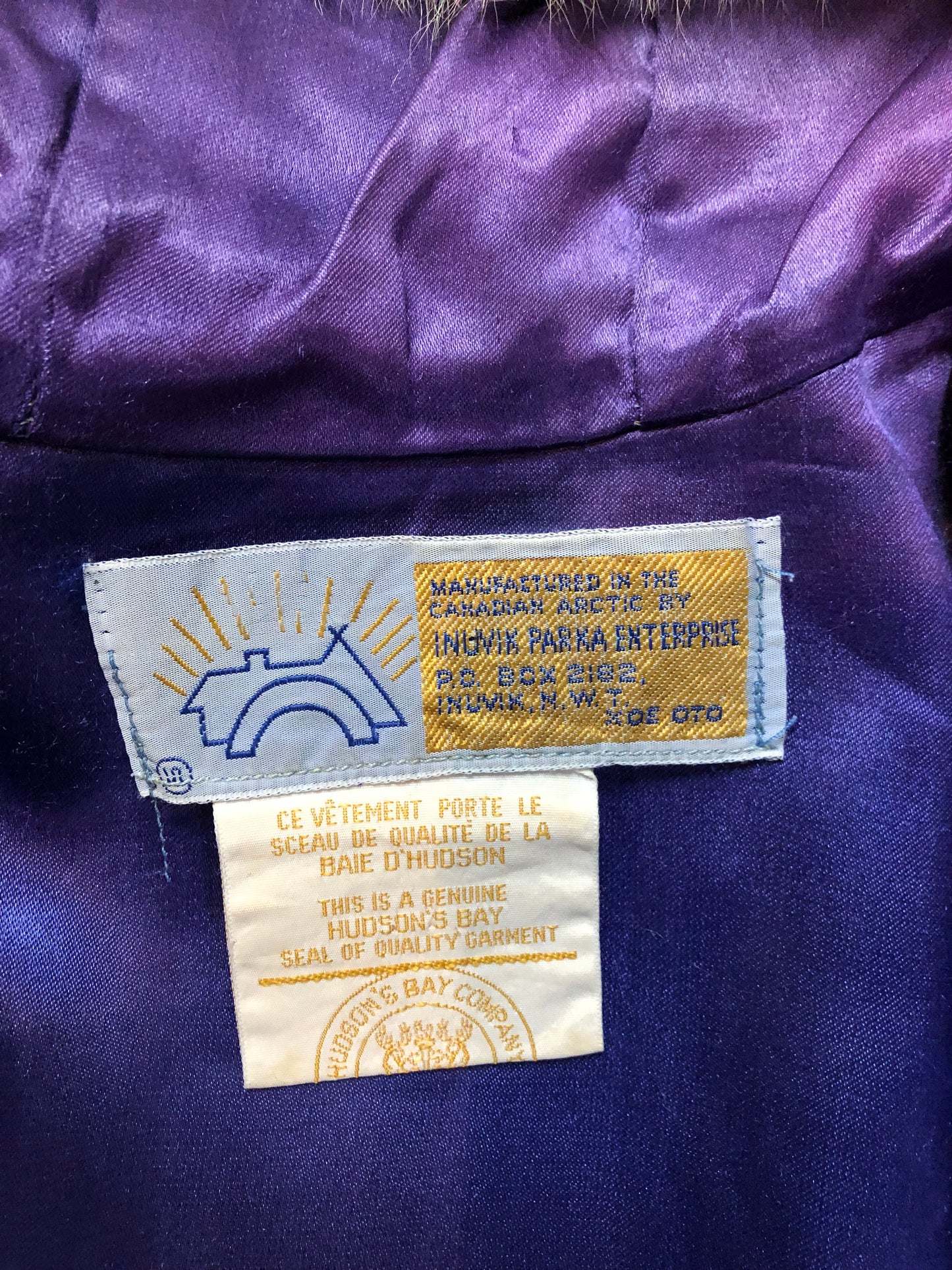Vintage Hudson’s Bay Company 100% pure wool northern parka in sky blue. This parka features a fur trimmed hood, zipper closure, patch pockets, purple satin lining and a drumming and dance design in felt applique. Made in Canada by the Inuvik Parka Company - Kingspier Vintage