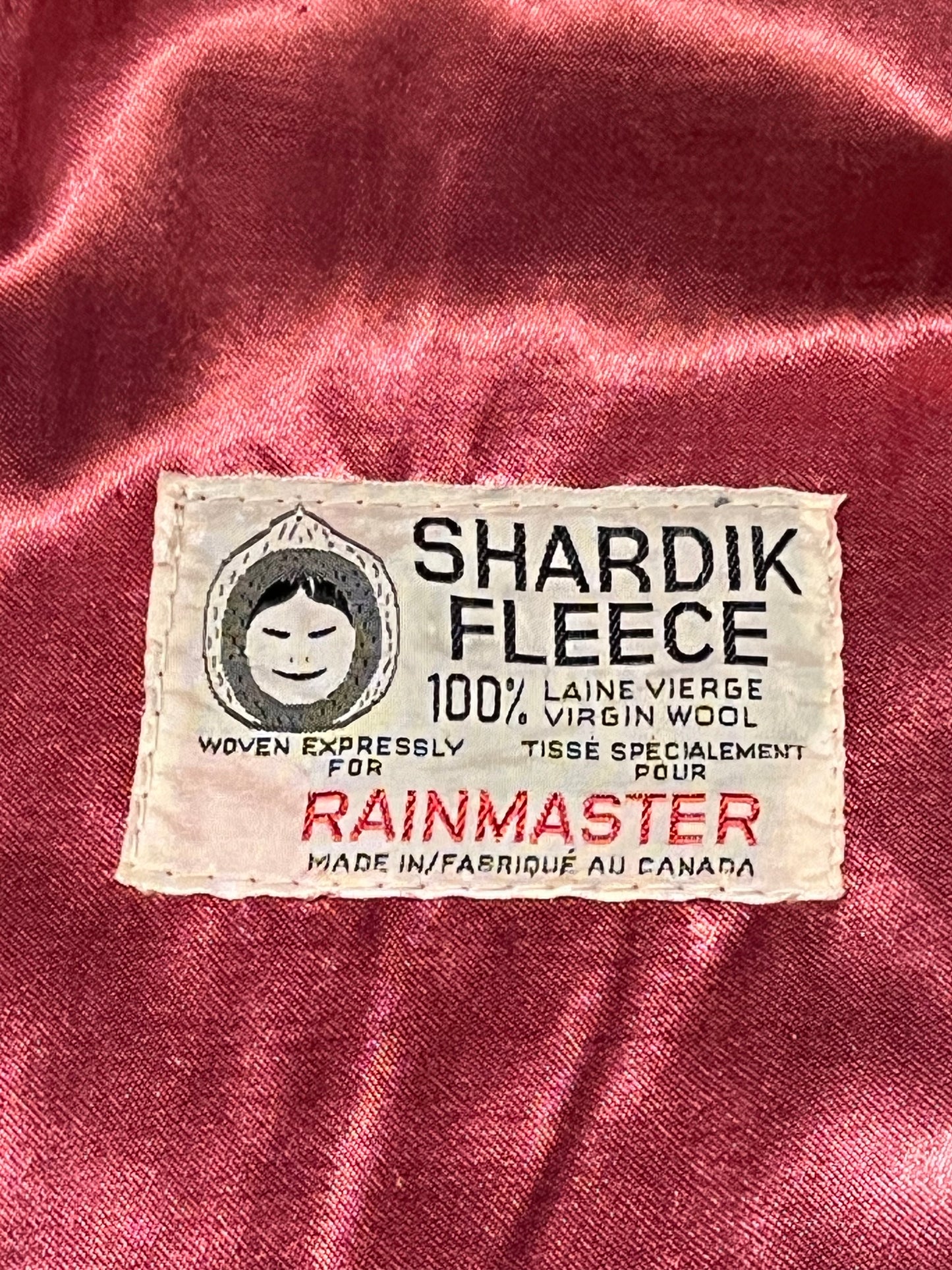 Vintage Shardik Fleece for Rainmaster red and black 100% pure virgin wool coat with belt, button closures, two front patch pockets and a satin lining.
Made in Canada
Chest 35”
