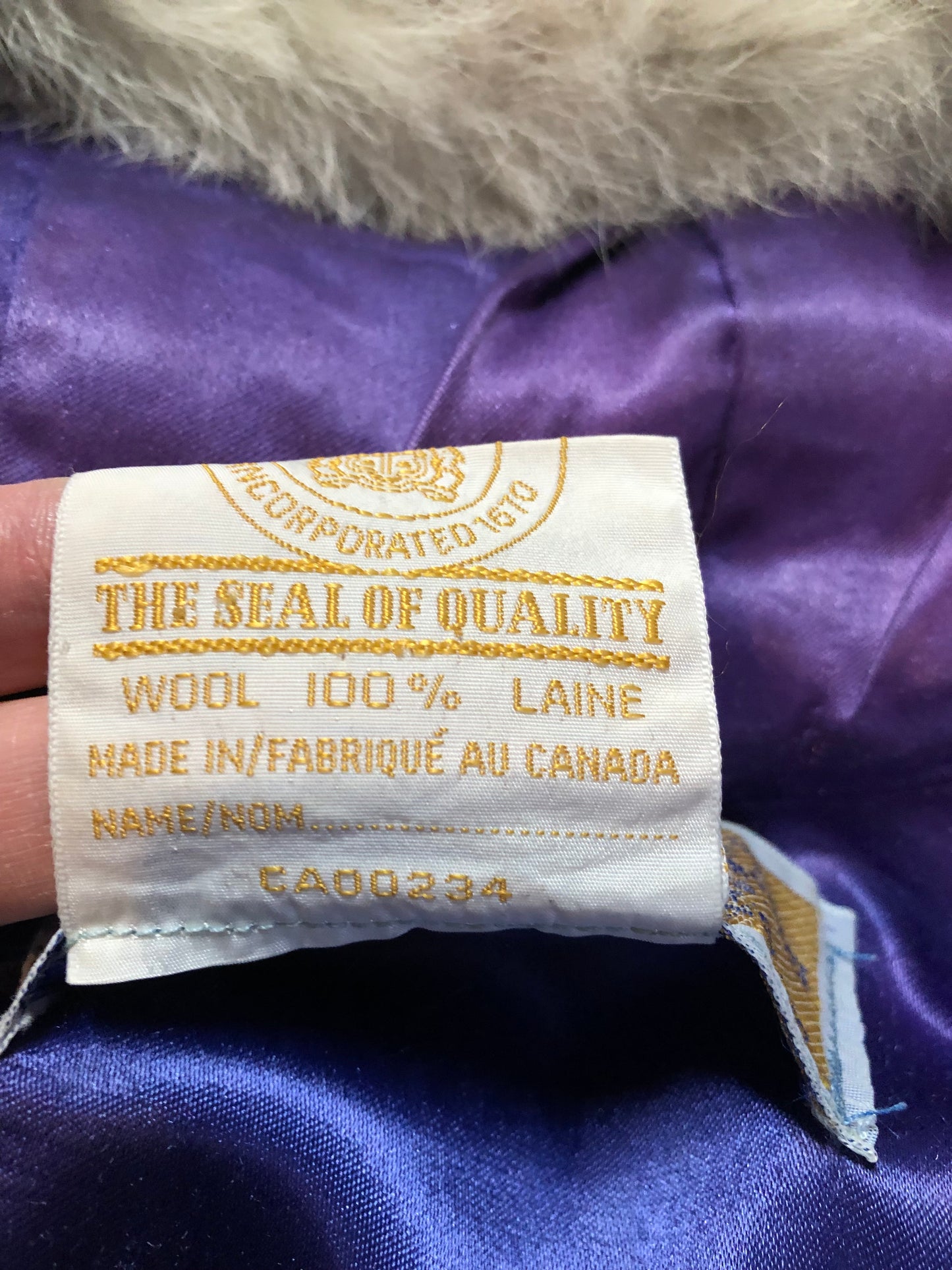 Vintage Hudson’s Bay Company 100% pure wool northern parka in sky blue. This parka features a fur trimmed hood, zipper closure, patch pockets, purple satin lining and a drumming and dance design in felt applique. Made in Canada by the Inuvik Parka Company - Kingspier Vintage