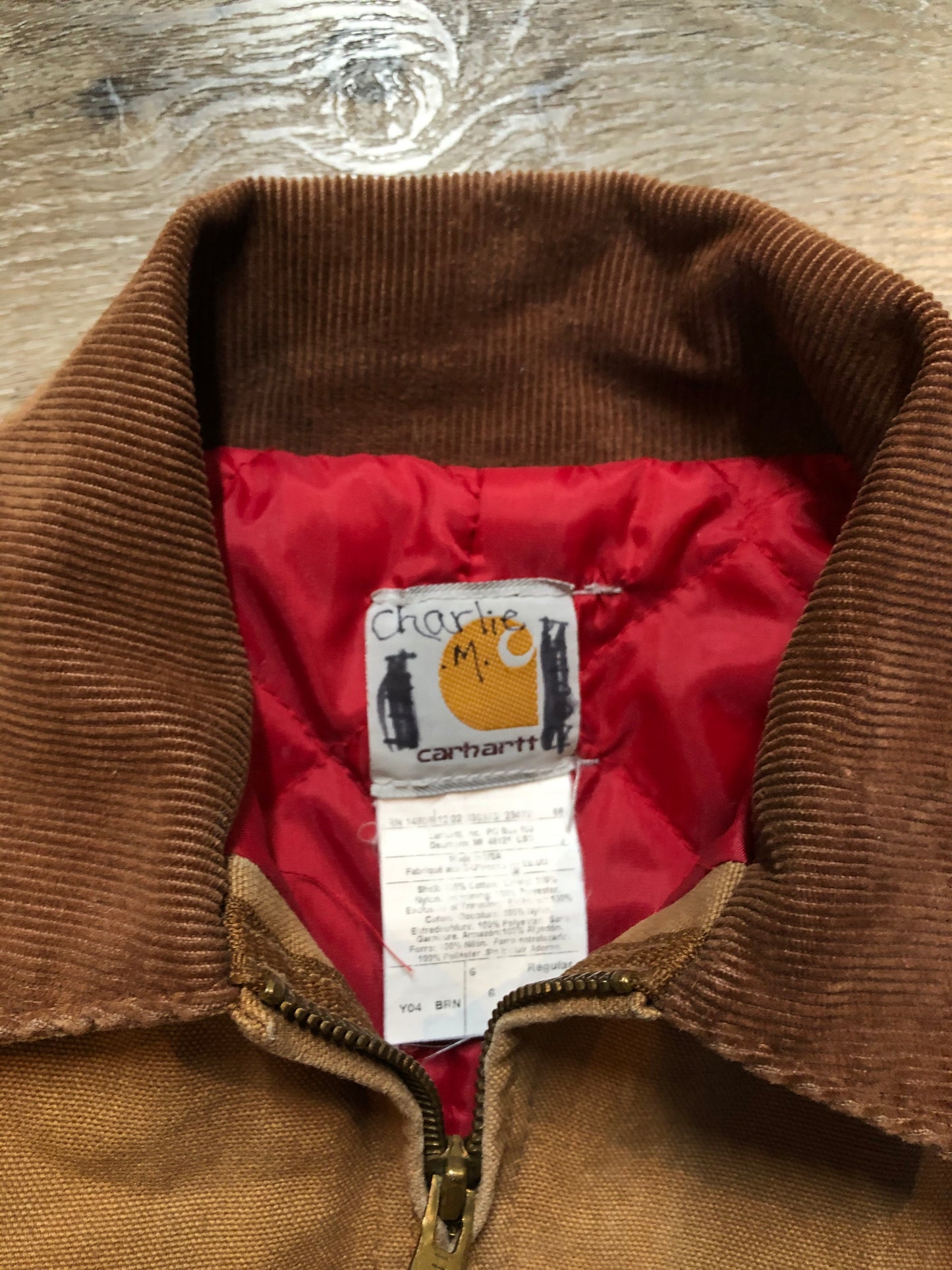 Kingspier Vintage - Kids Carhartt Chore Jacket in Tan Brown with Brown corduroy collar, zipper closure, slash pockets, knit inner cuffs and red quilted lining. Made in the USA. Size childrens 6.