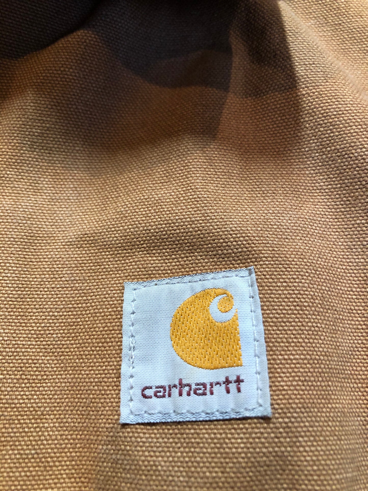Kingspier Vintage - Kids Carhartt Chore Jacket in Tan Brown with Brown corduroy collar, zipper closure, slash pockets, knit inner cuffs and red quilted lining. Made in the USA. Size childrens 6.