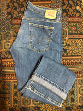 Load image into Gallery viewer, Vintage Levi’s Low Slouch Boot Cut Denim Jeans  Red tab  Low rise  Button fly  Boot cut leg.  93% Cotton/ 5% Polyester/ 2% Lycra  Medium wash  Made in Mexico - Kingspier Vintage
