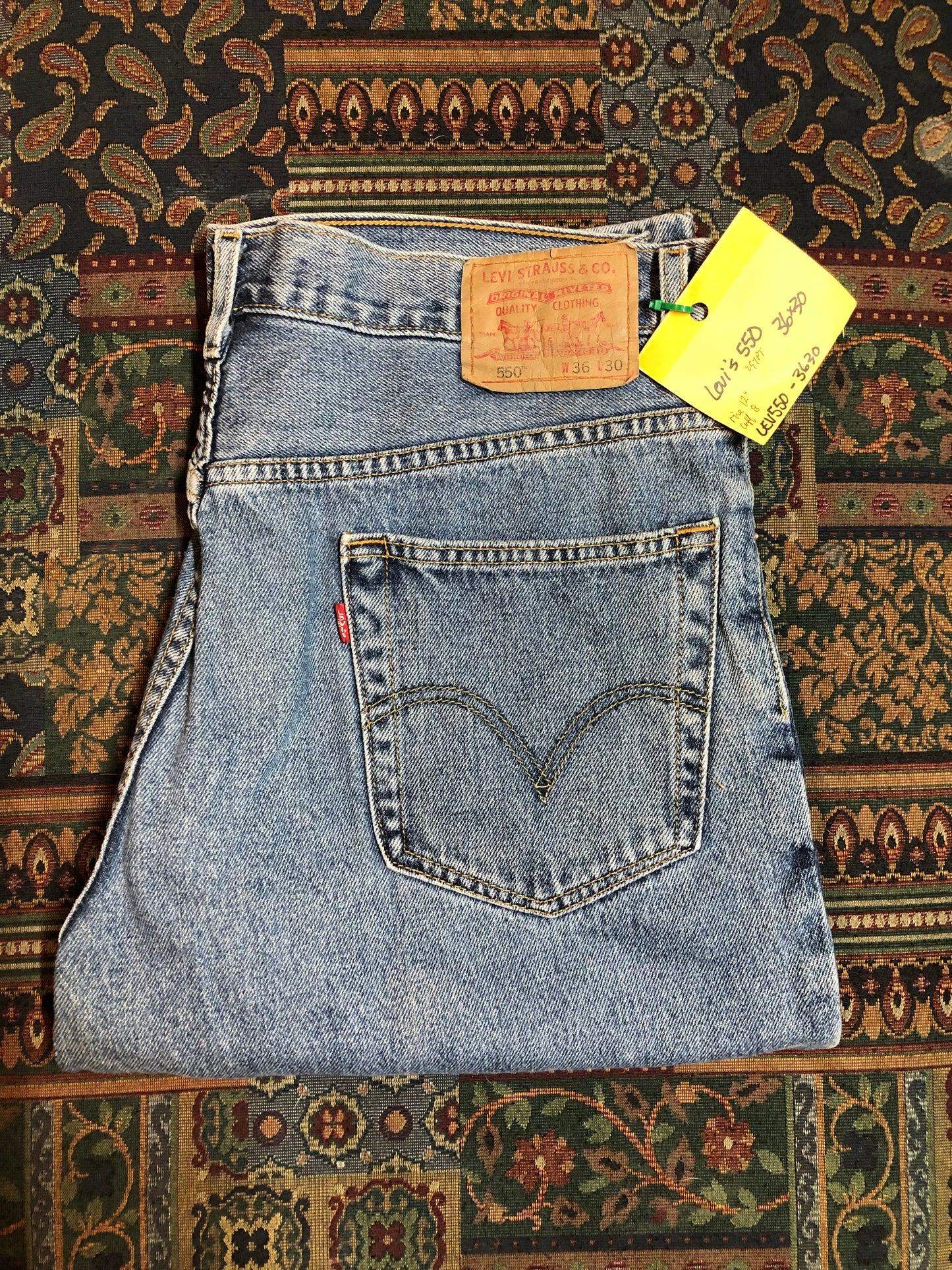 Levi’s 550 - 36”x30” Denim Jeans Relaxed fit Red tab High rise Button fly Tapered leg Lighter wash 100% cotton Made in Egypt - Kingspier Vintage