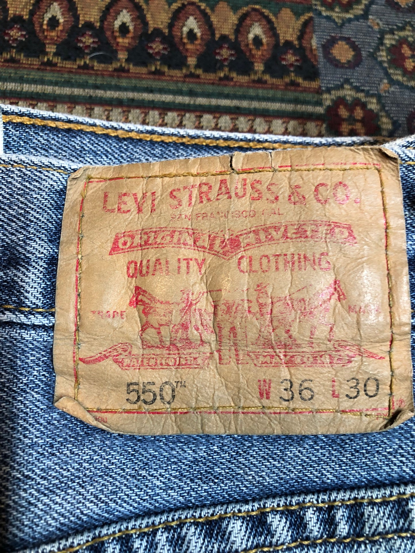 Levi’s 550 - 36”x30” Denim Jeans Relaxed fit Red tab High rise Button fly Tapered leg Lighter wash 100% cotton Made in Egypt - Kingspier Vintage