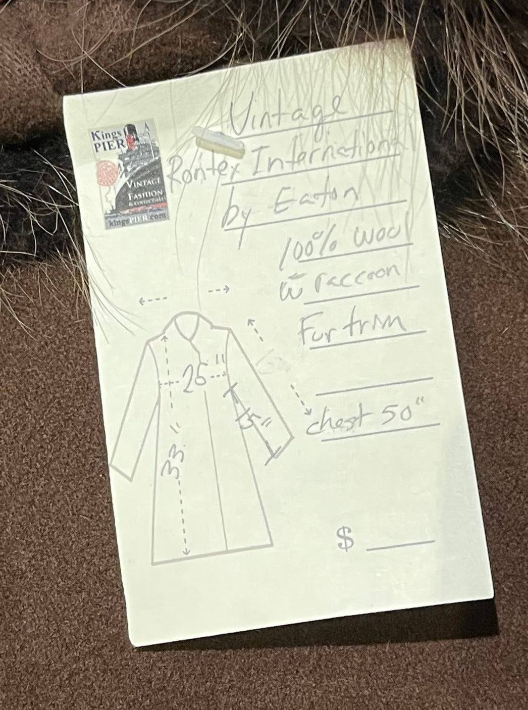Vintage Rontex International for Eaton brown 100% wool swing coat with raccoon fur trim, button closures and two front pockets.
Made in Canada
Chest 50”