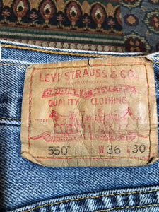 Levi’s 550 - 36”x30” Denim Jeans  Relaxed fit  Red tab  High rise  Button fly  Tapered leg  Lighter wash  100% cotton  Made in Egypt - Kingspier Vintage