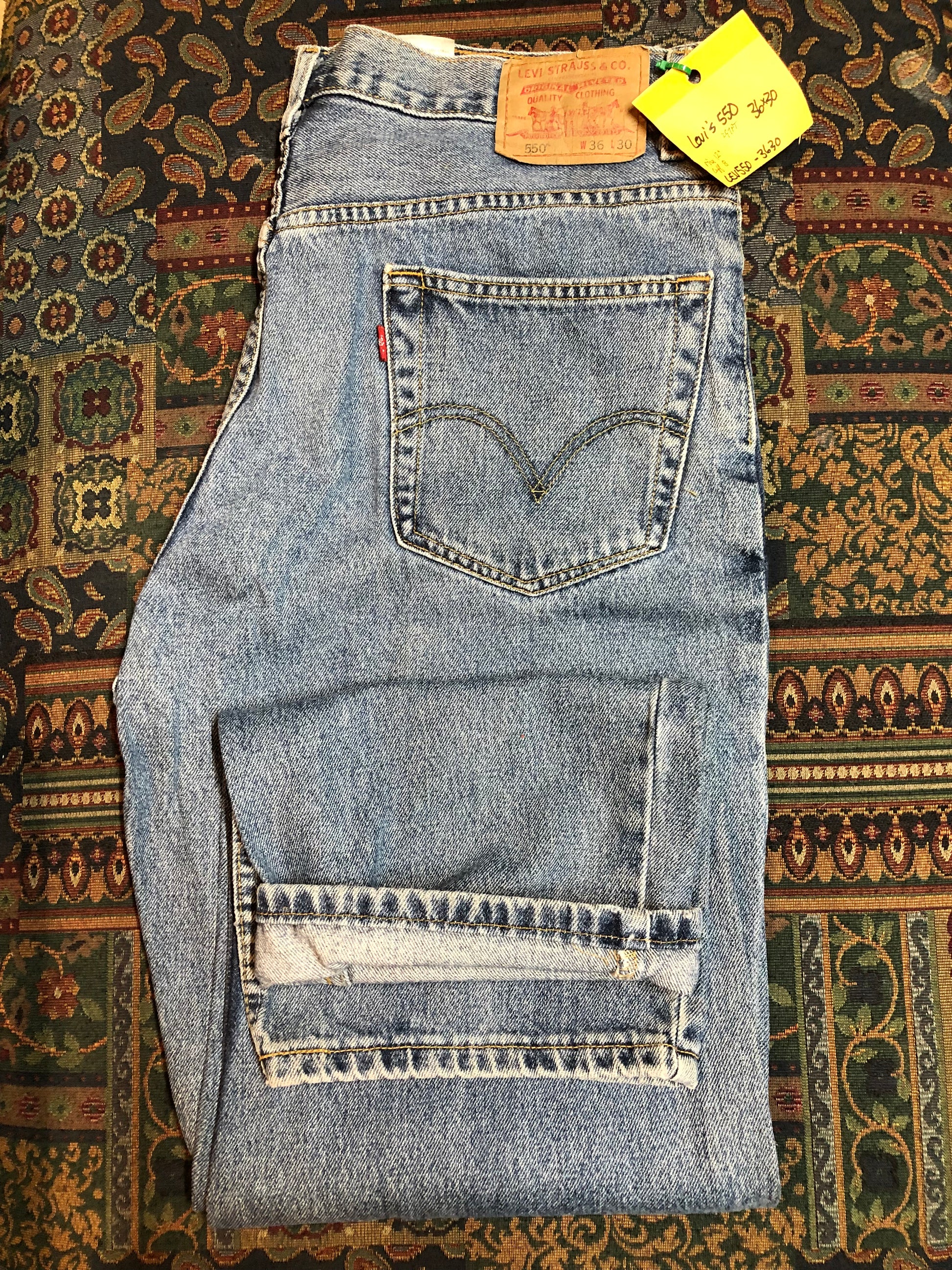 Levi’s 550 - 36”x30” Denim Jeans  Relaxed fit  Red tab  High rise  Button fly  Tapered leg  Lighter wash  100% cotton  Made in Egypt - Kingspier Vintage