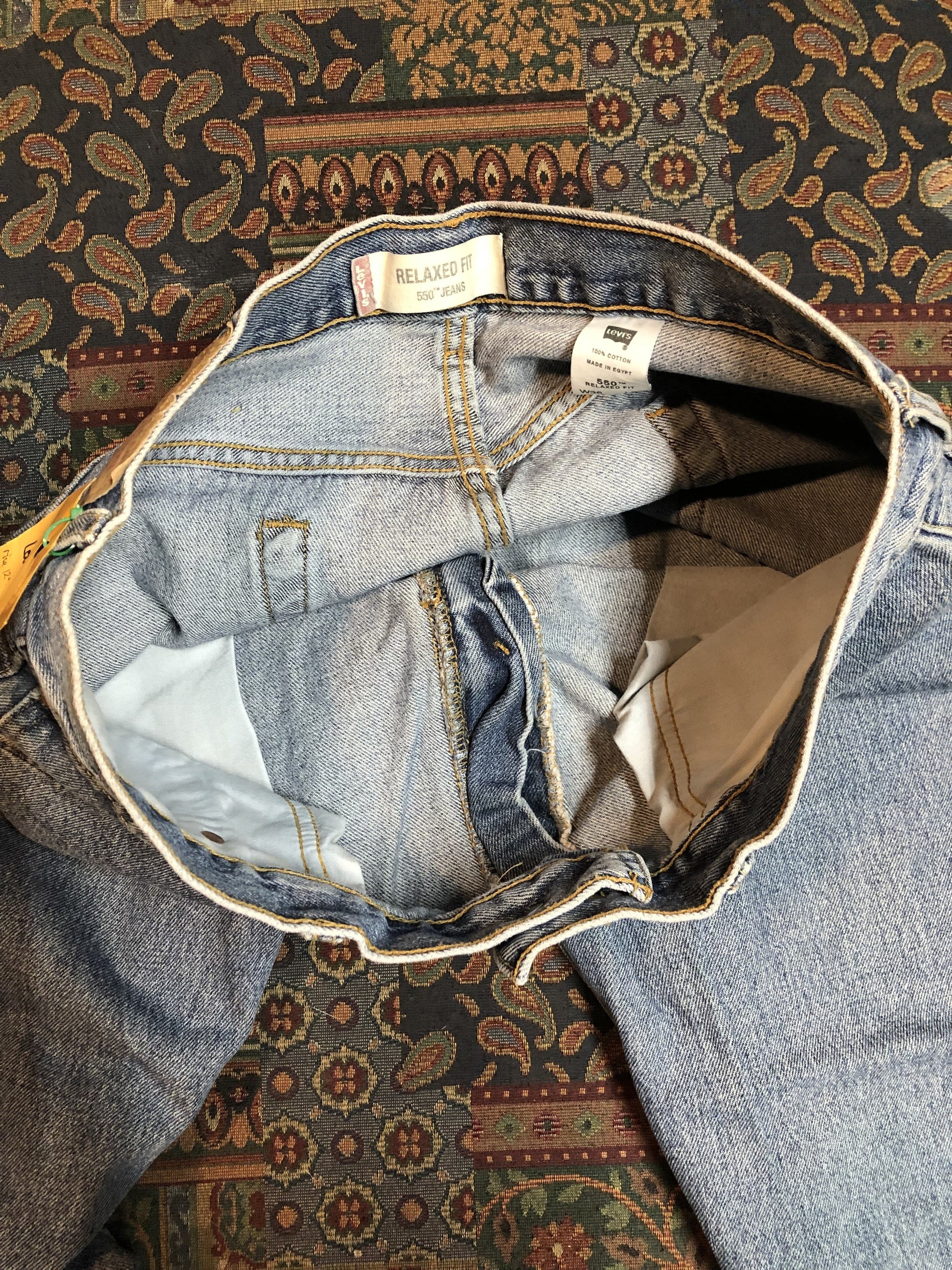 Levi’s 550 - 36”x30” Denim Jeans  Relaxed fit  Red tab  High rise  Button fly  Tapered leg  Lighter wash  100% cotton  Made in Egypt - Kingspier Vintage