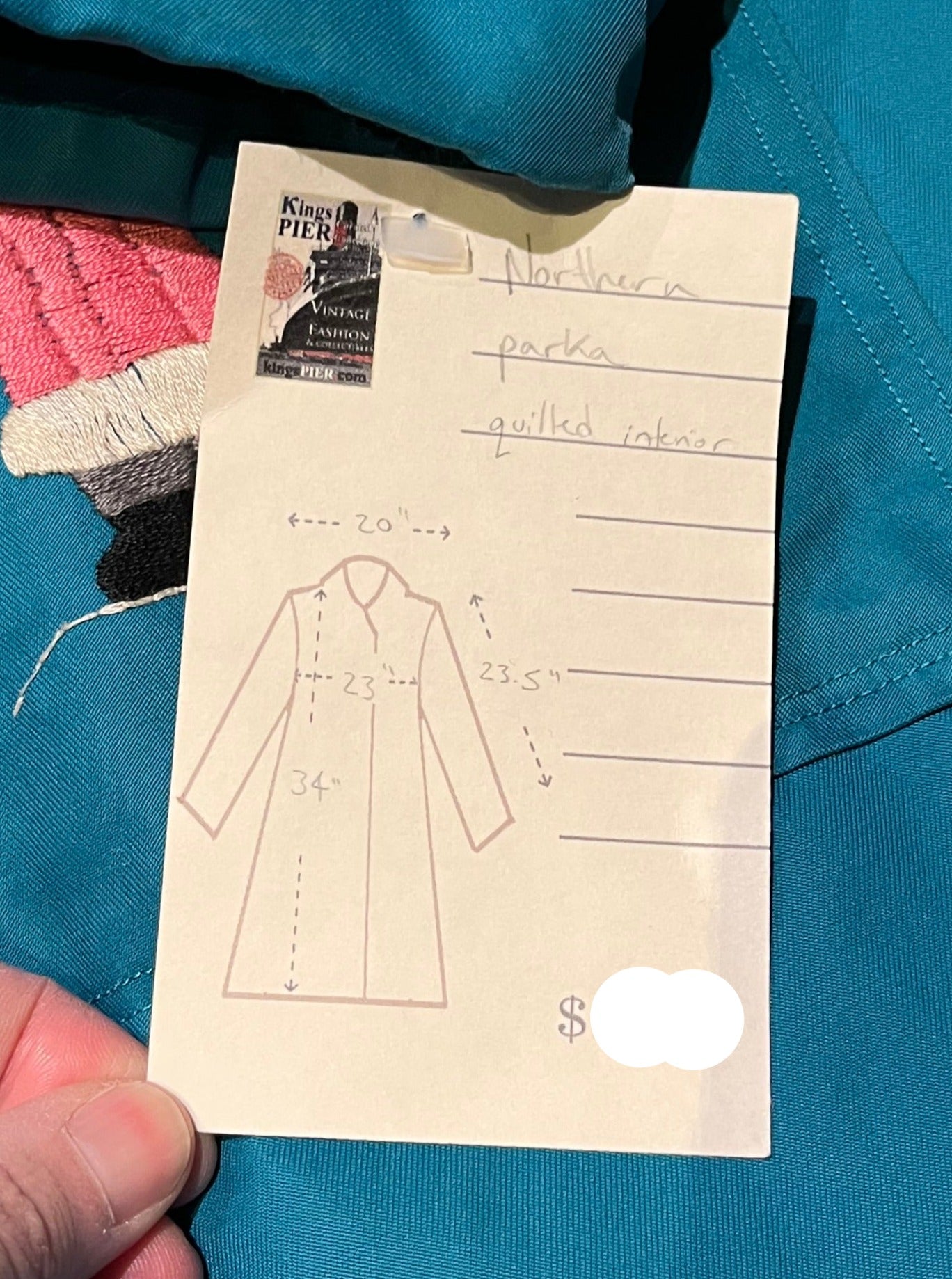 Vintage teal northern parka with fur trimmed hood, fur pom poms, zipper closure, patch pockets in the front and hand embroidered details.
Chest 46”